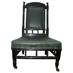 Gregory & Co. London, an Aesthetic Nursing Chair with Stylized Carved Sunflower