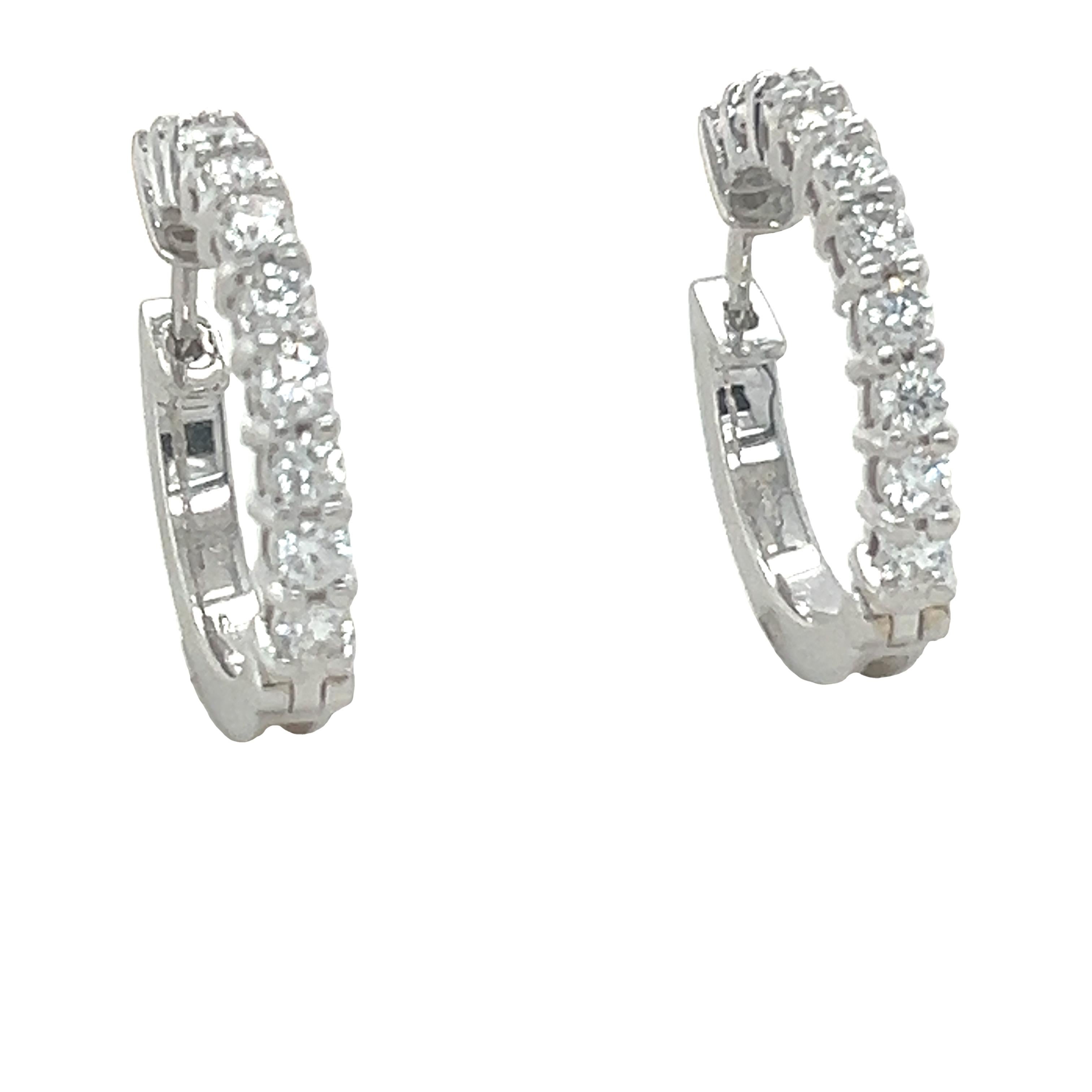 A pair of Gregory Diamond hoop earrings made of 18ct White Gold, and weighing 8.8 gm. Stamped: 750.

The earrings are set with 20 round, brilliant cut Diamonds, colour F-G and clarity VS-SI. with a total weight of 1.50 ct.

Metal: 18ct White