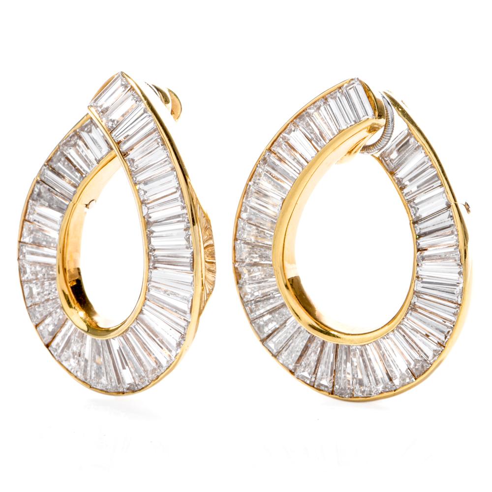 These estate earrings of notable elegance are designed and signed by the renowned New York designer Gregory Stewart, crafted in 18 karat yellow gold, weighing approx. 17.4 grams and measuring 31 mm long x 24 mm wide. These earrings expose an