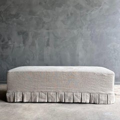 Greige Linen Slip Covered Bench with Pleated Skirt Details and White Oak Legs