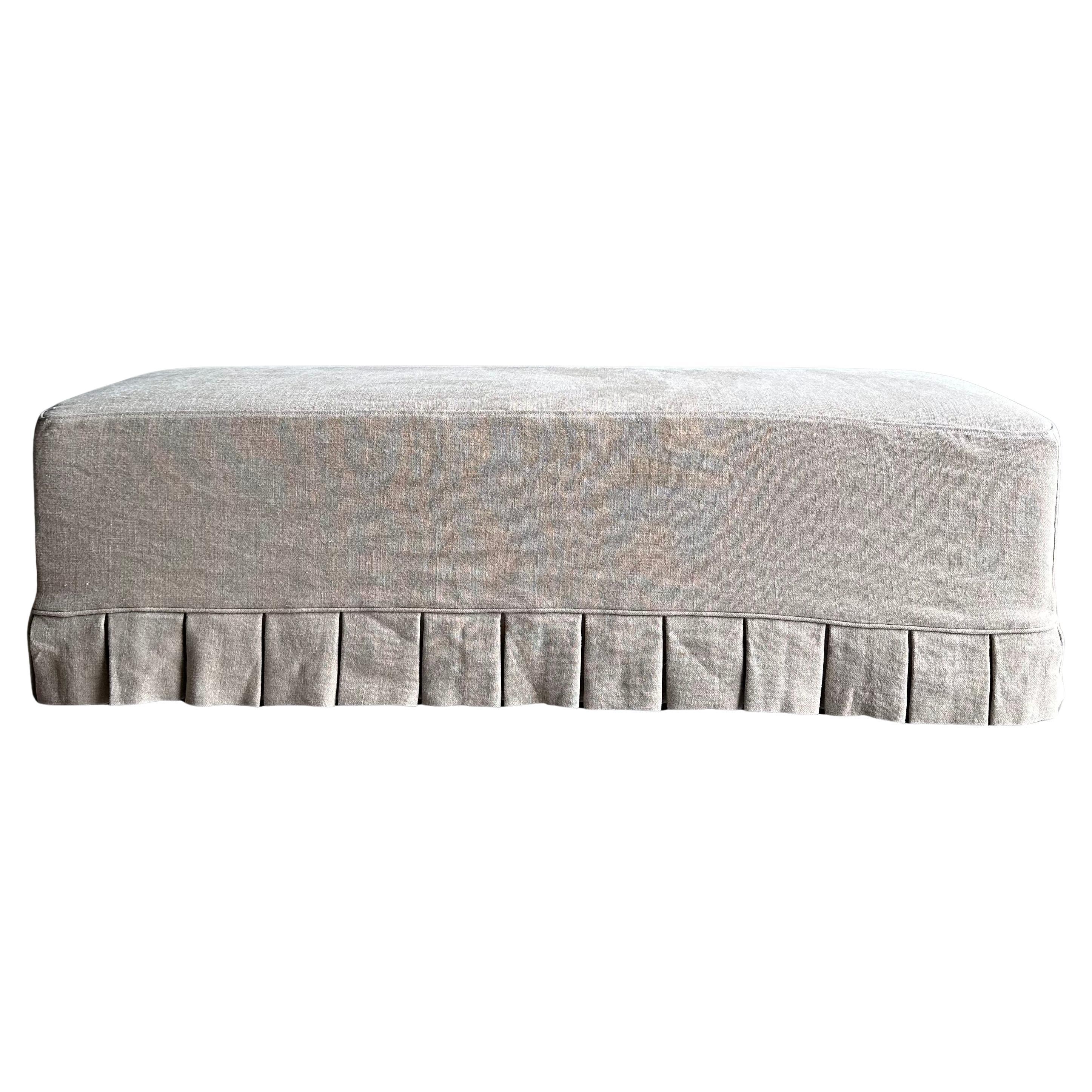 Greige Linen Slip Covered Bench with Pleated Skirt Details and White Oak Legs