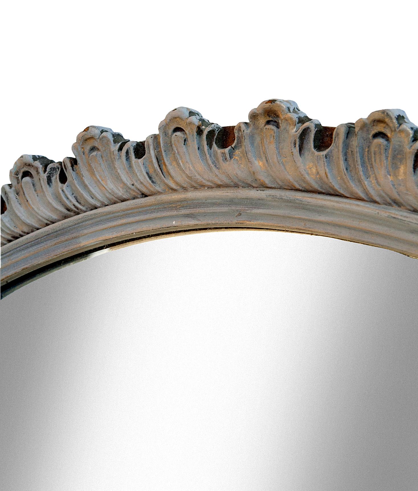A stunning Art Deco-style mirror featuring the original glass.
The swirl motif frame is hand painted in a natural greige/euro linen paint is accent in gold then waxed. There are some defects to the glass.

