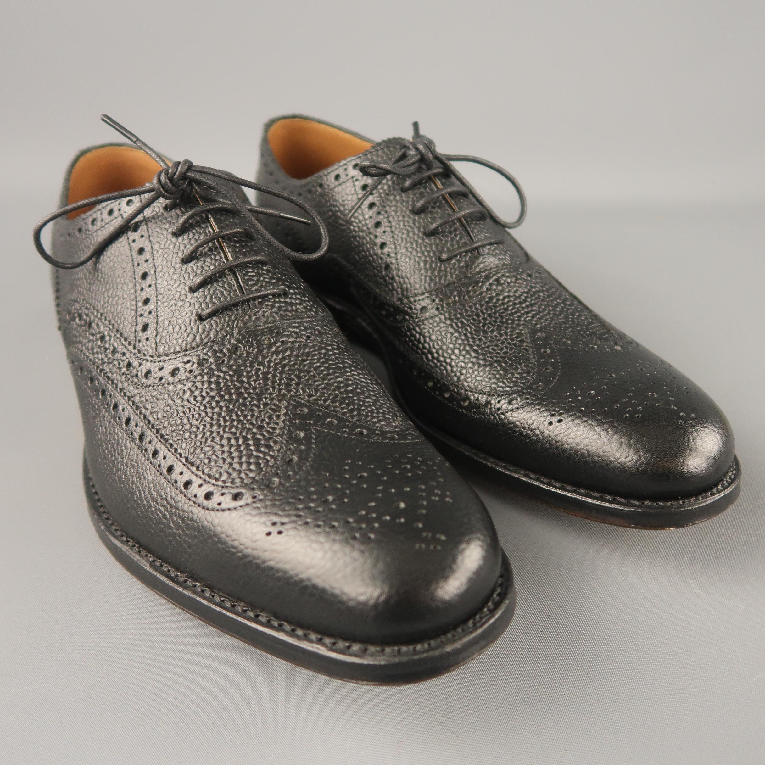 GRENSON wingtip shoes comes in a black leather perforated pattern featuring a wooden heel sole.
 
Brand New.
Marked: 7 E
 
Measurements:
 
Width: 4.4 in.
Length: 12 in.
