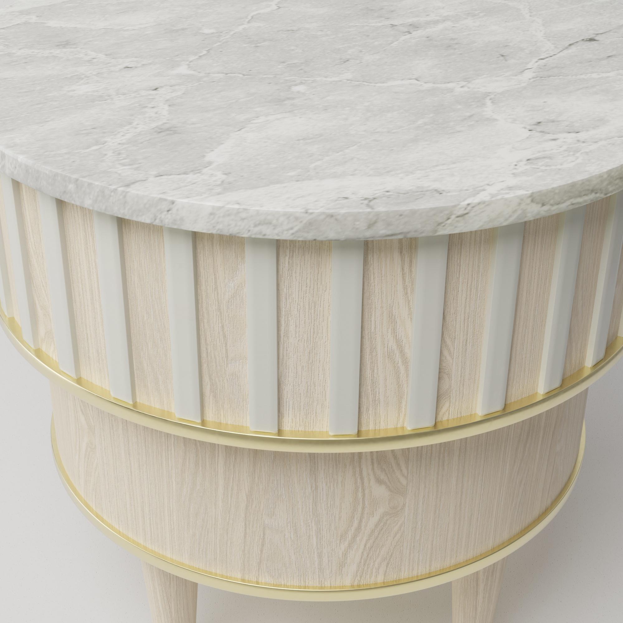 Greta white onyx side table by Felice James. The beautiful white onyx stone top is offset against the bone Corian, bleached oak and liquid brass. This side table evokes a dramatic, illusive feel.