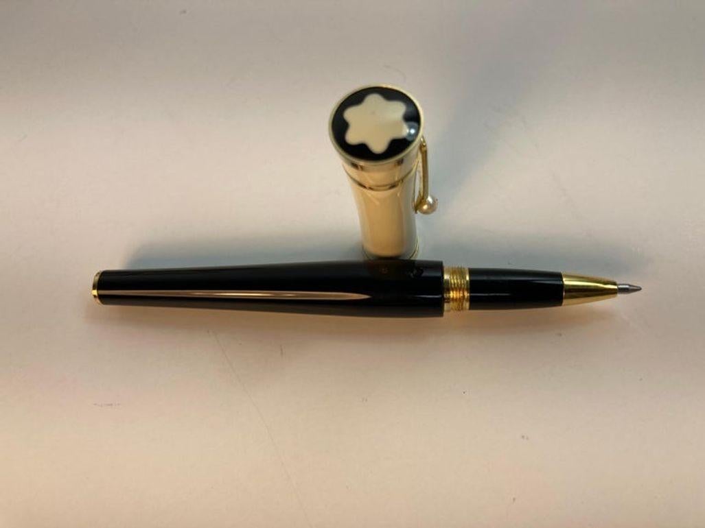 Greta Garbo Limited Edition Mont Blanc Ballpoint Rollerball pen with pearl.
Montblanc honors Greta Garbo in the form of another mystical writing instrument.
The extraordinary design with a black barrel, a cream colored cap, both made of precious