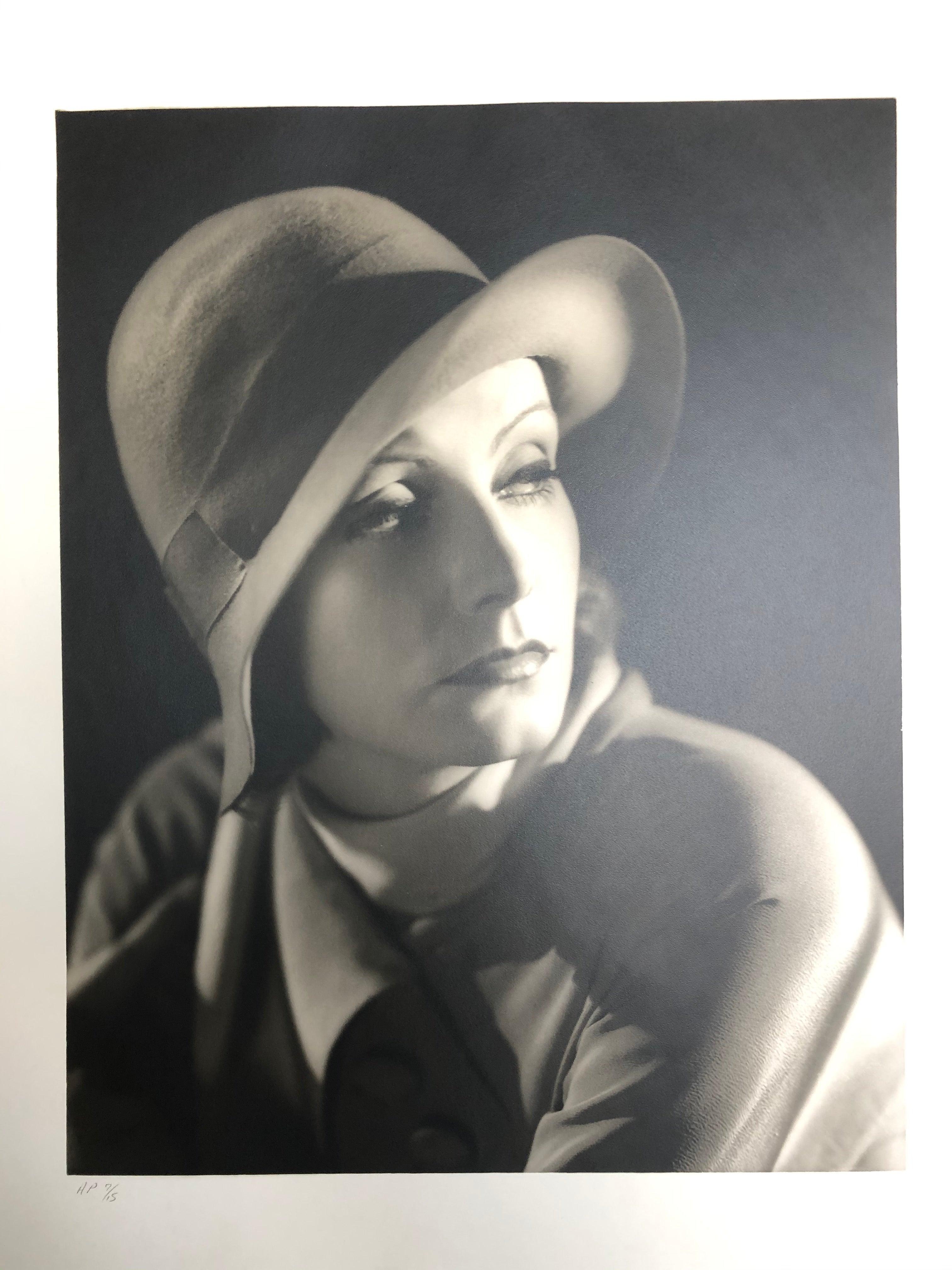 Greta Garbo-bowler hat vintage
AP 7/15
Image size: 14 x 11 In
Sheet size: 2- x 16 in
Embossed signature
Printed later

Along with George Hurrell, Clarence Sinclair Bull effectively invented the Hollywood celebrity still, with romantic images