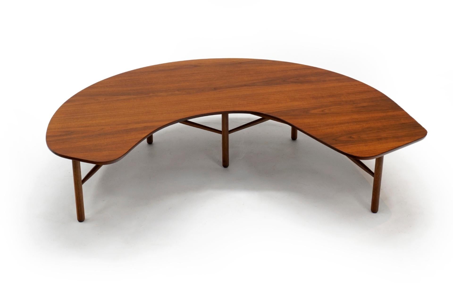 Walnut coffee / cocktail table designed by Greta Magnuson Grossman for Glenn of California, 1952. Organic boomerang shaped top with five legs connected by stretchers. Beautiful geometric design. Expertly refinished and in excellent condition.