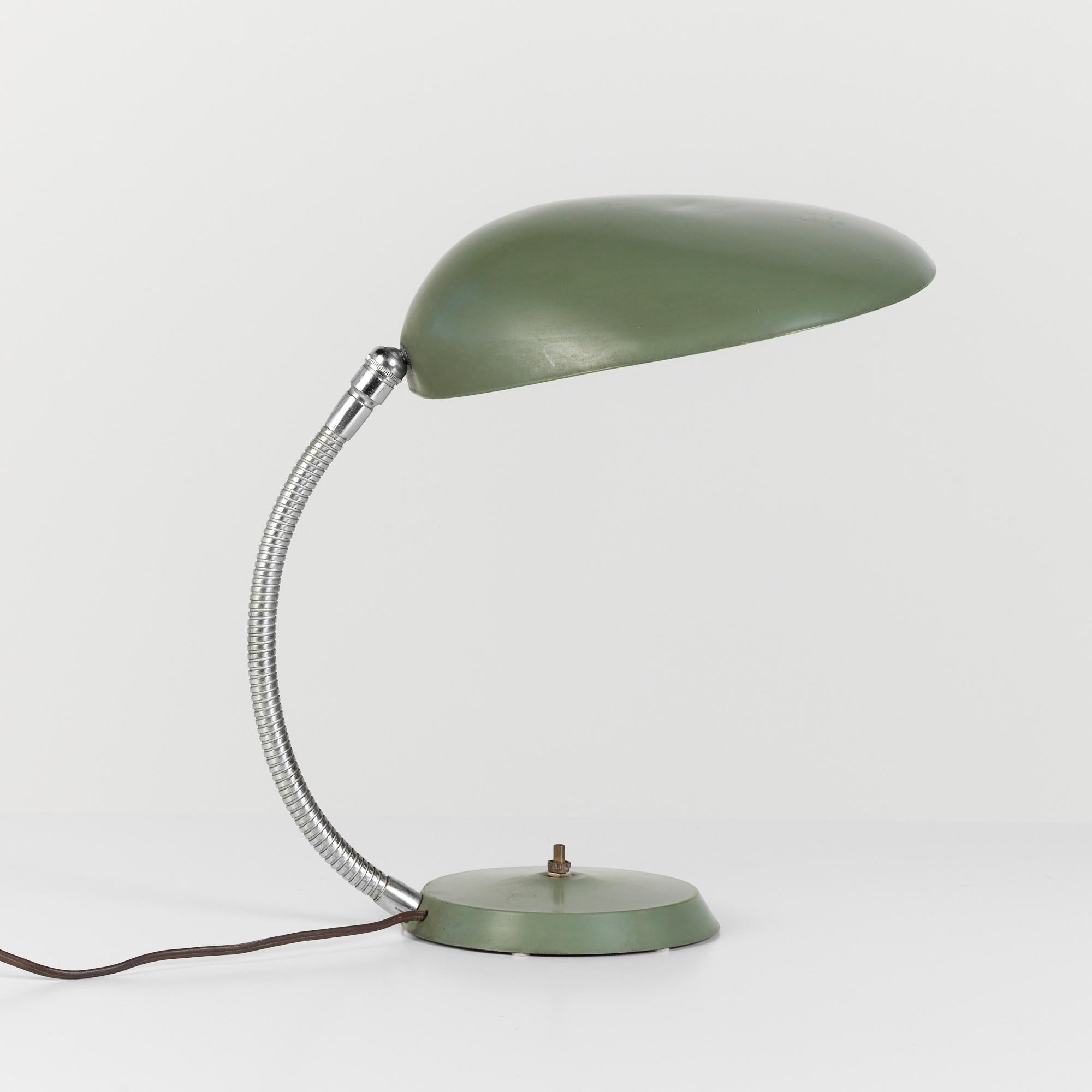 An award-winning 1948 design by Swedish-American Greta Grossman for Ralph O. Smith, a California-based lighting company. The lamp, colloquially known as the “Cobra” for its uniquely shaped shade that resembles a cobra’s hood, is counterweighted with