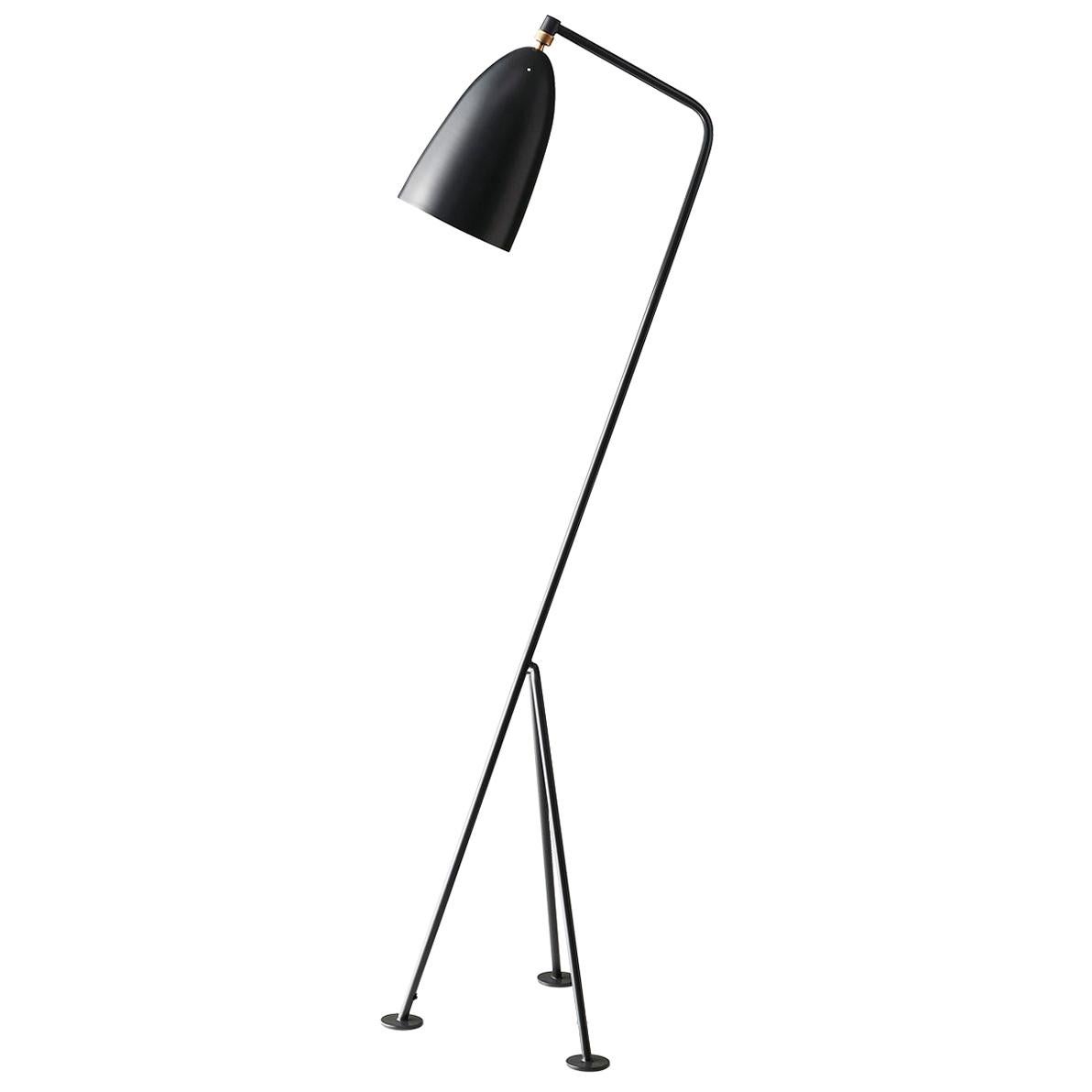 The iconic Grasshopper Floor Lamp was first produced in 1947 by the feminine pioneer Greta M. Grossman. The unique tripod stand of the Grasshopper Floor Lamp is tilted backward and gives the impression that the lamp is somehow alive and stalking its