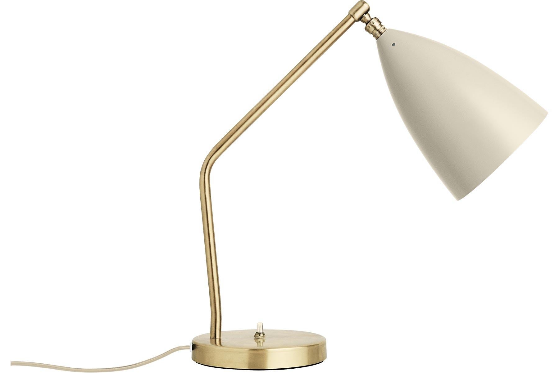 Greta M. Grossman designed the iconic Gräshoppa table lamp in 1947 and with its sophisticated yet playful design, it is still as relevant today. The distinctive, elongated conical shade is beautifully combined with a tubular brass Stand, a great
