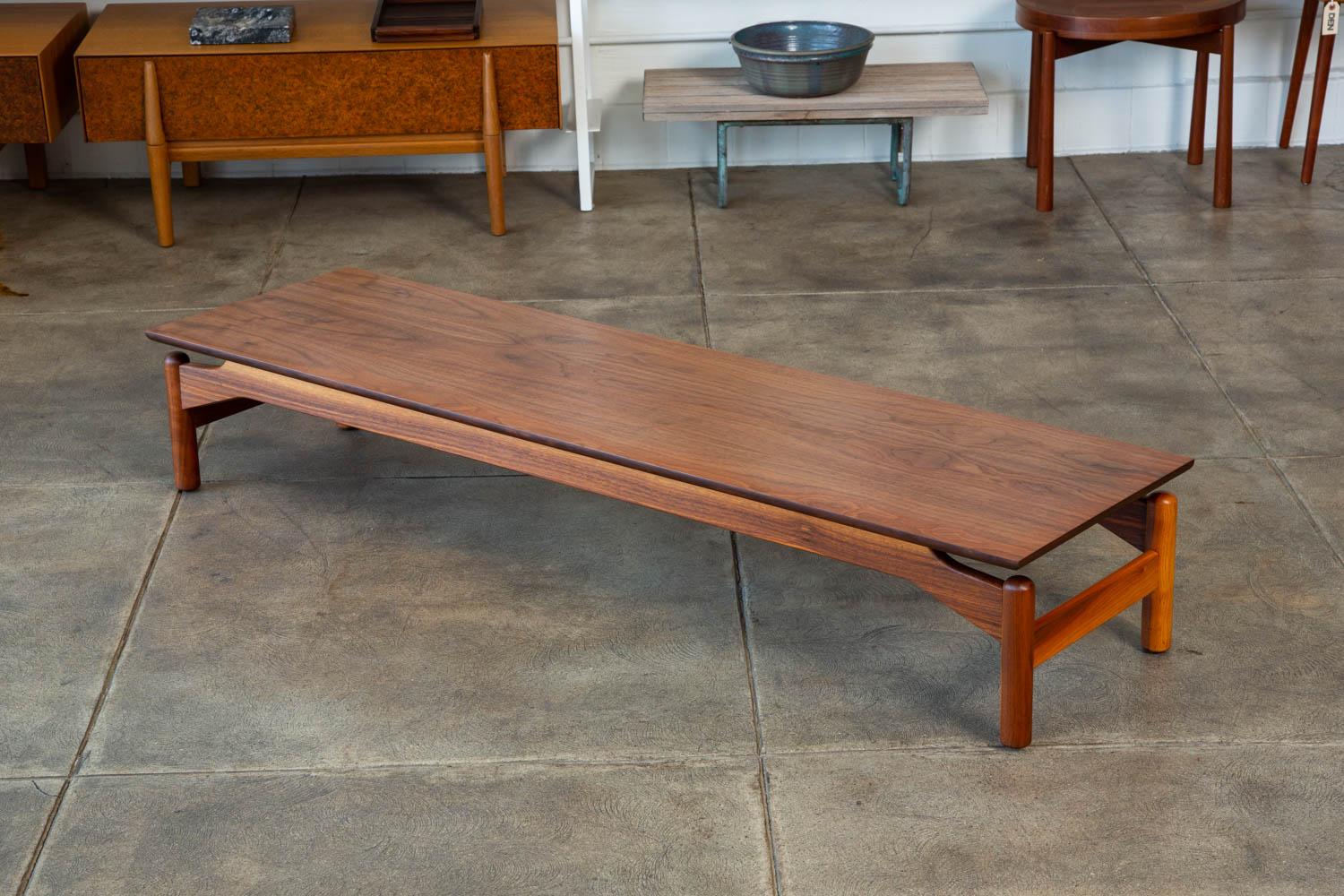 Greta Grossman for Glenn of California walnut bench or coffee table. This rare example features a floating walnut top with beautiful grain and turned walnut pillar legs.

Condition: Excellent restored condition; professionally refinished and