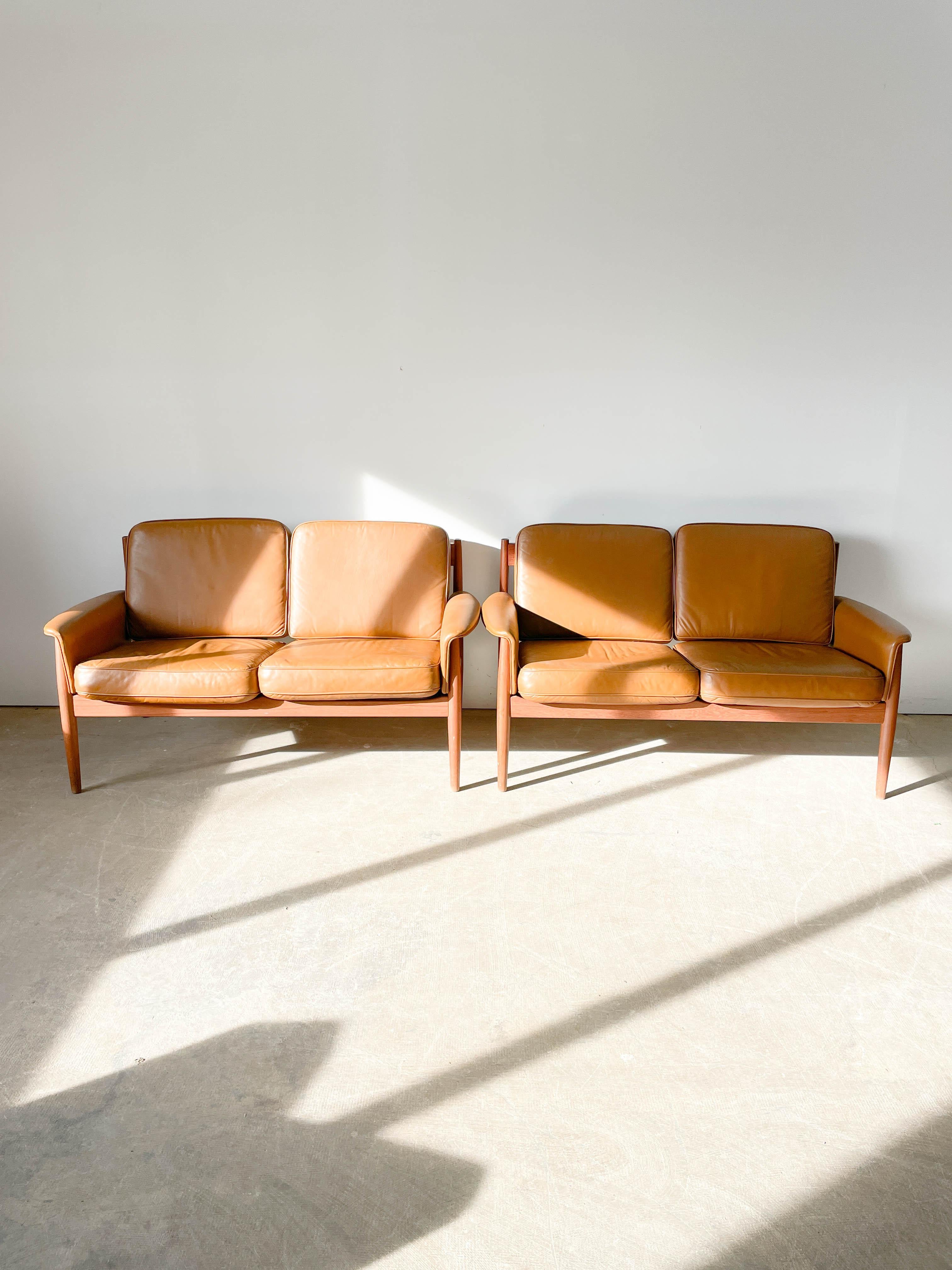 Mid-Century Modern Greta Jalk teak and leather loveseats for France and Son For Sale