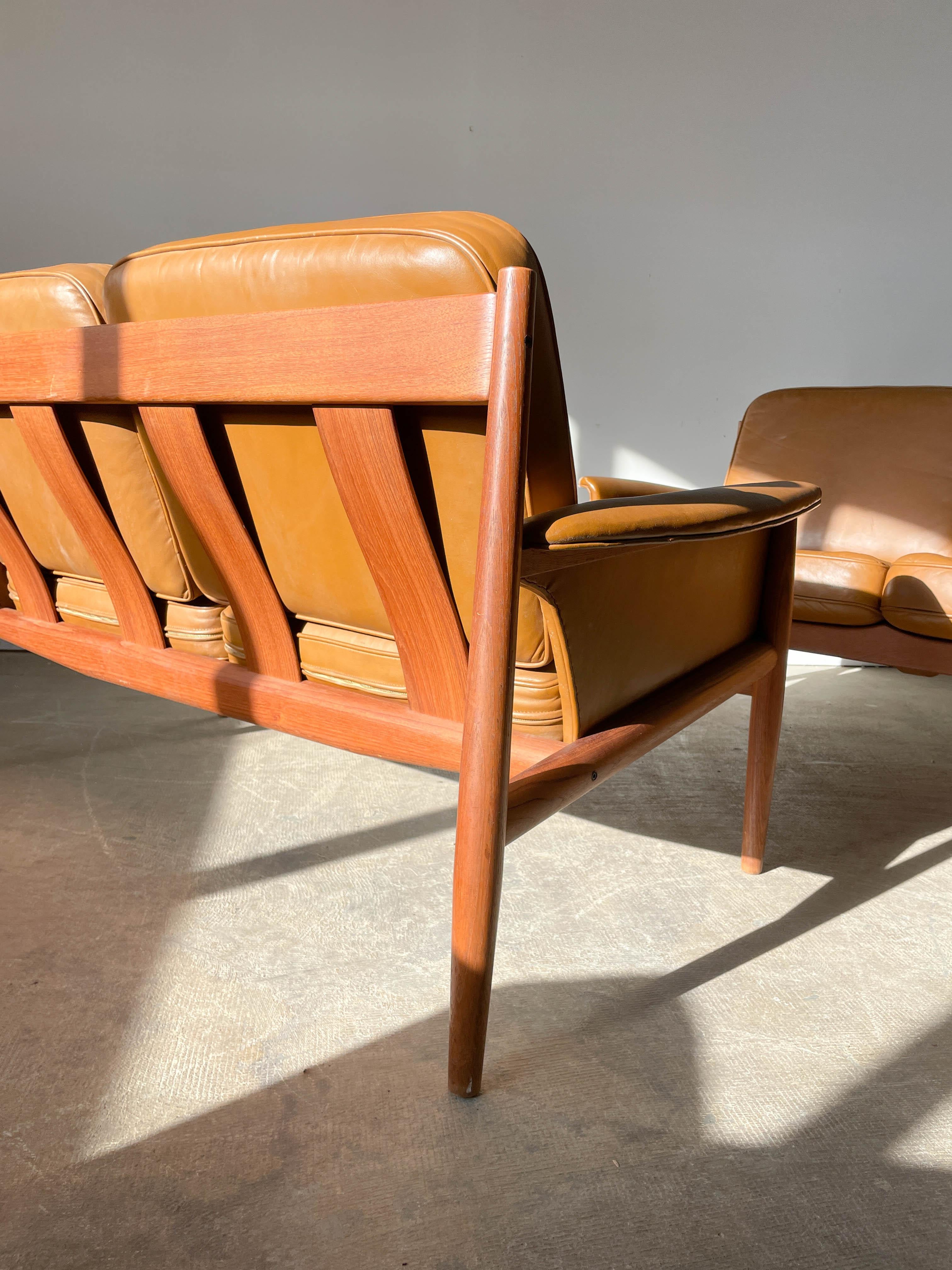 20th Century Greta Jalk teak and leather loveseats for France and Son For Sale