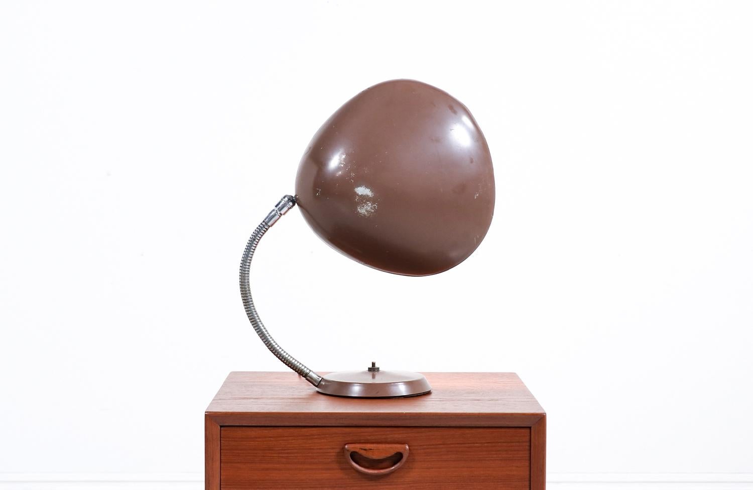 The “Cobra” table lamp designed by Greta M. Grossman for Ralph O. Smith in the United States in 1948. A true icon of Mid-Century modern lighting design and winner of the MoMA Good Design award in 1950, this sophisticated table lamp features an