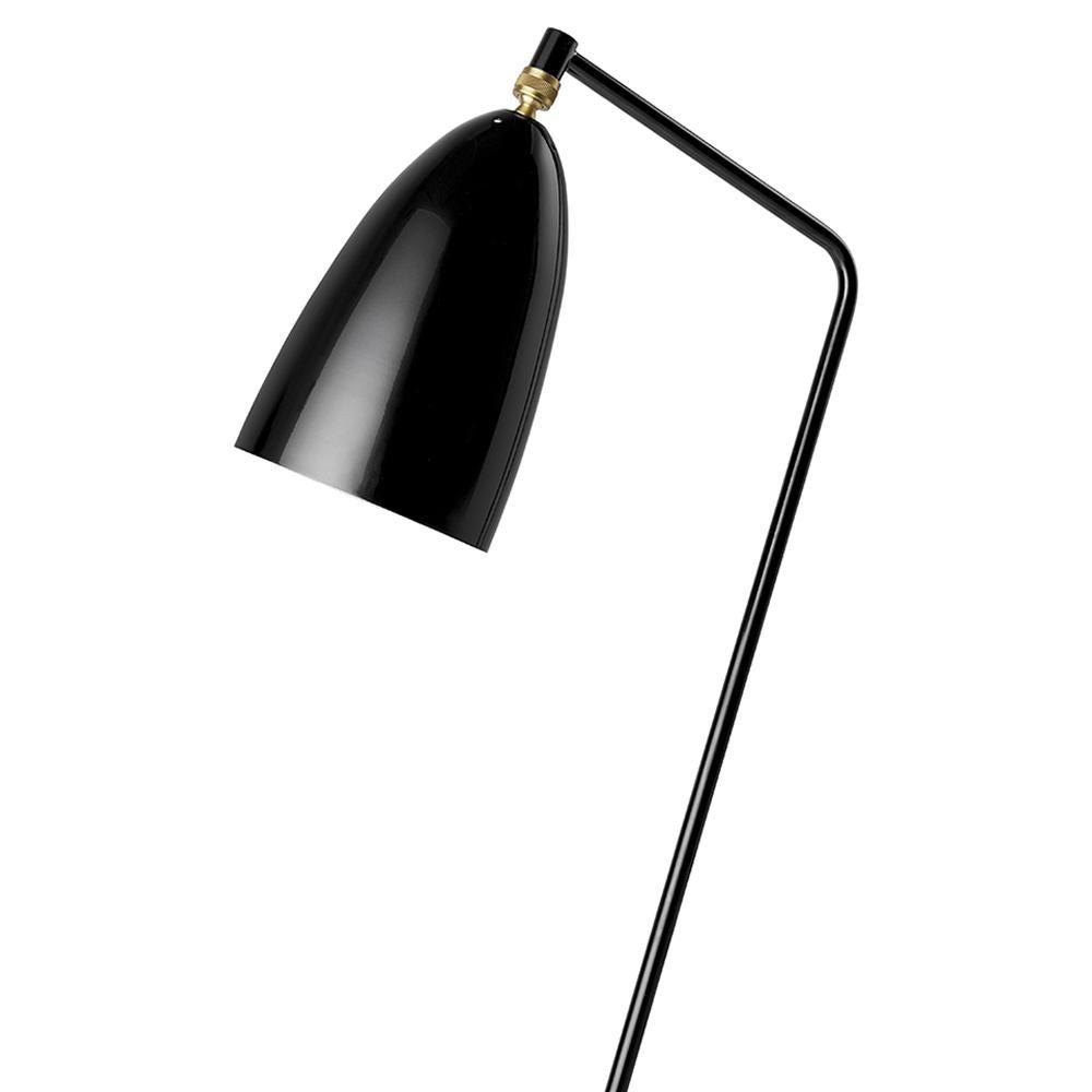 The iconic Gräshoppa Floor Lamp was first produced in 1947 by the feminine pioneer Greta M. Grossman. The unique tripod stand of the Gräshoppa Floor Lamp is tilted backwards and gives the impression that the lamp is somehow alive and stalking its