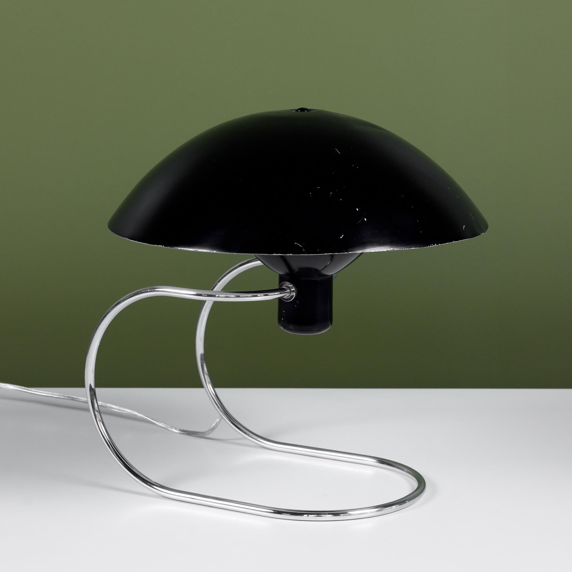 The Anywhere Lamp, designed by Greta von Nessen c.1952, USA, for Nessen Studios. The lamp coined its name by being able to be placed anywhere! It was originally advertised to be used as a table lamp, wall lamp or hanging pendant. It features a black