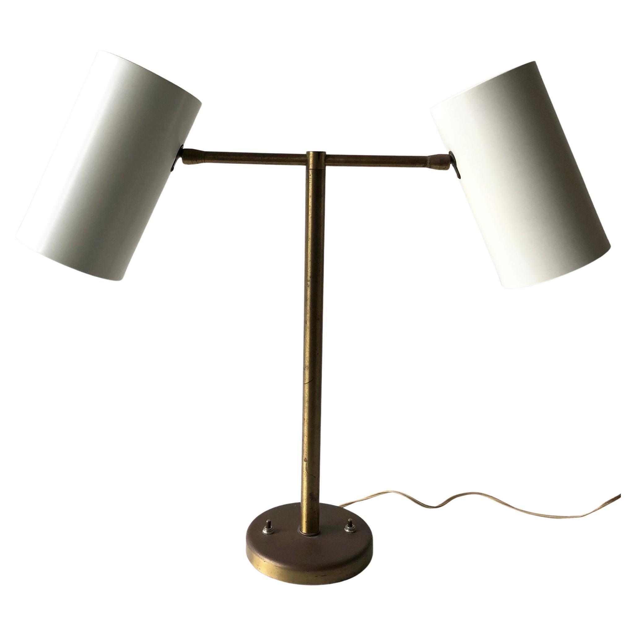 1950s adjustable double cone lamp designed by Greta Von Nessen.  Lamp measures 20.5