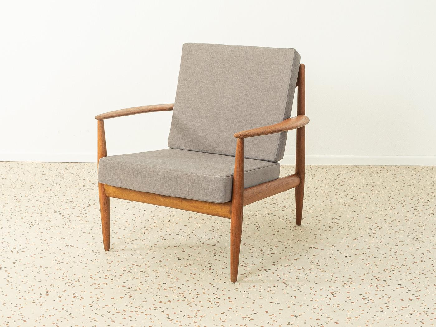Rare armchair by Grete Jalk, model 118 for France & Daverkosen. The armchair comes from the first series from 1955. High quality solid teak wood frame. The seat and backrest have been newly upholstered and covered with a high-quality gray upholstery