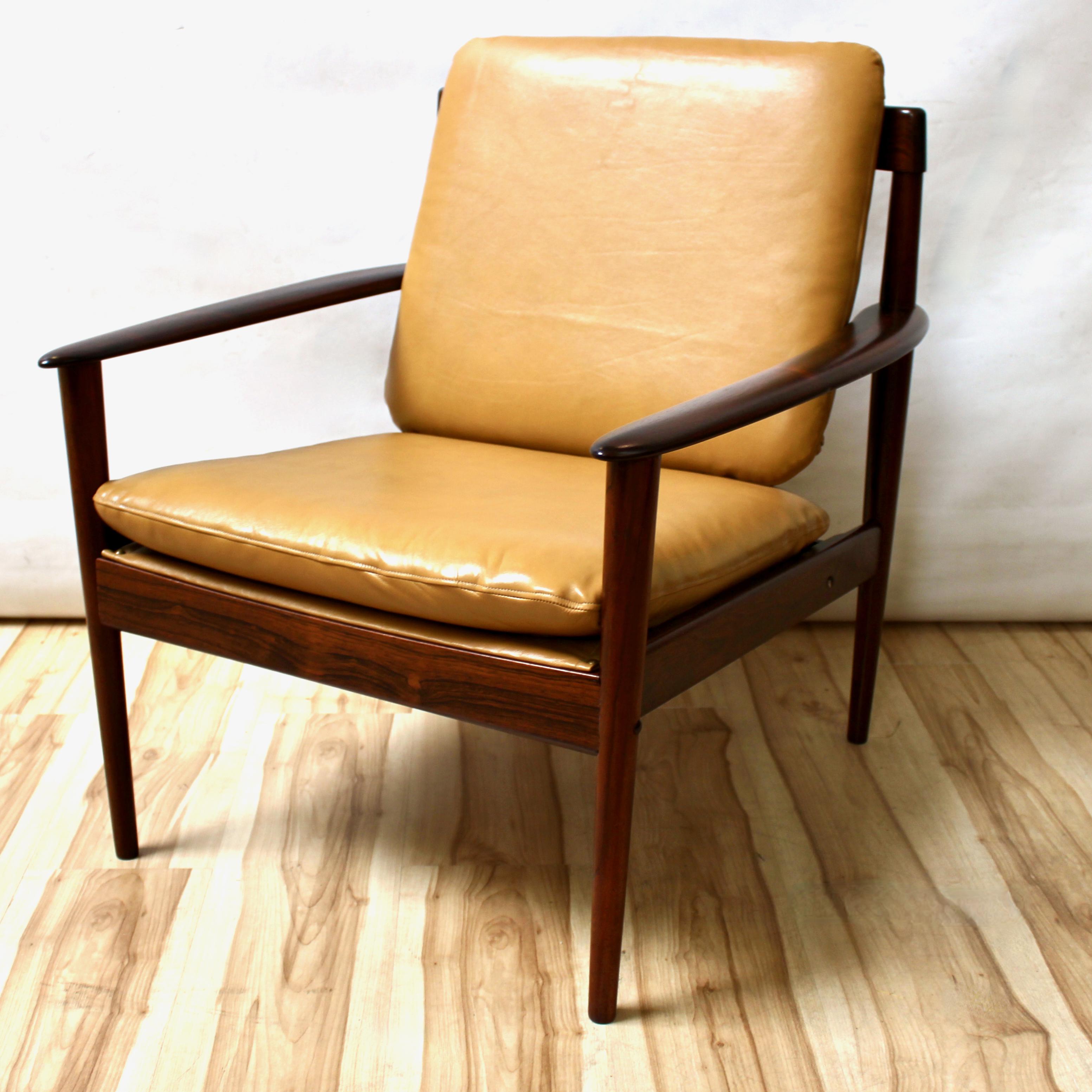 1950s Danish Modern rosewood model 56 lounge chair designed by Greta Jalk for Poul Jeppesen with leather seat and back The chair has been professionally restored and reupholstered with new material. In excellent condition.

Width: 28 in / Depth: