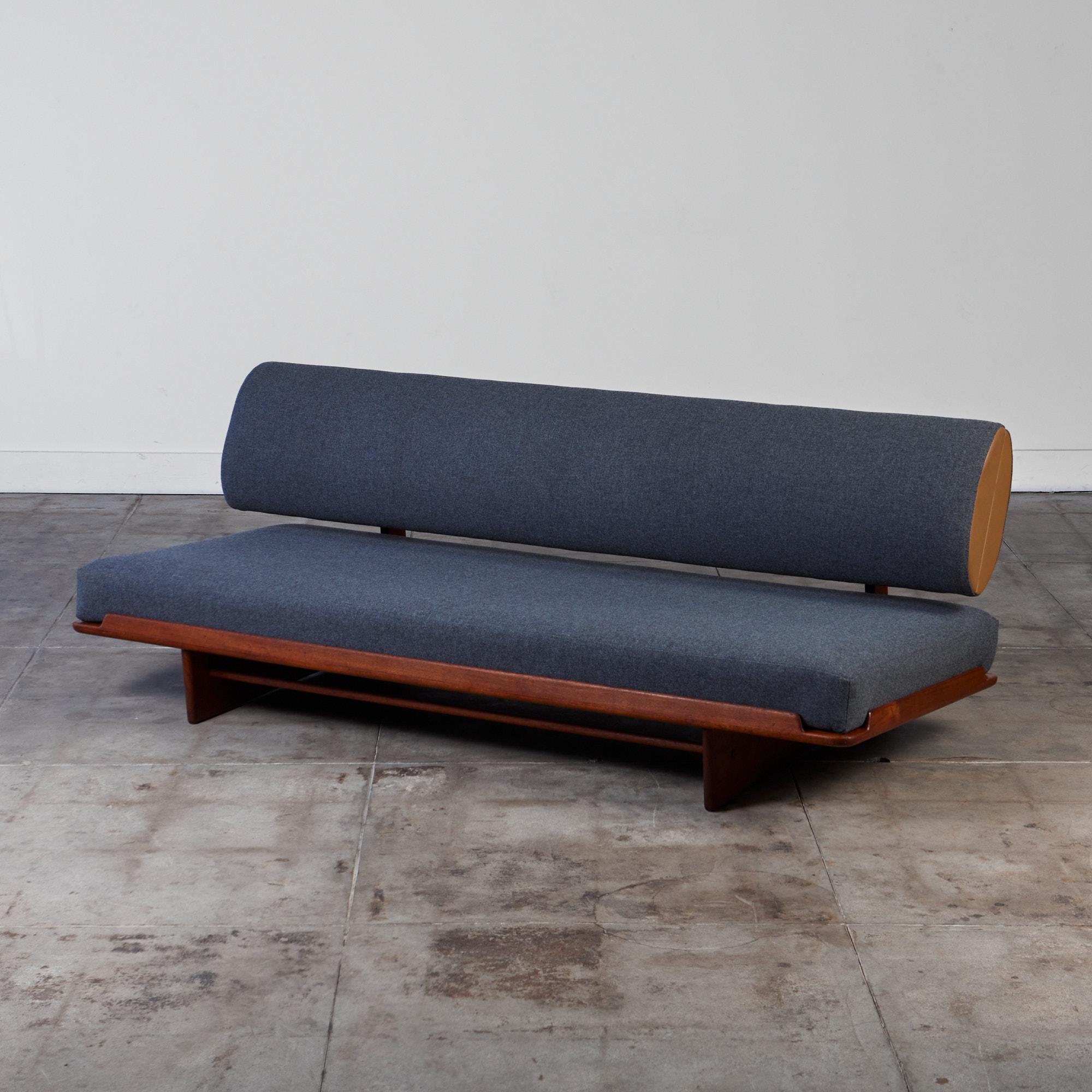 Rare convertible teak daybed by Grete Jalk for Poul Jeppesen, c.1960s. This piece features unique design elements making it the ideal daybed. The wide seat cushion can be gently pulled out creating a deeper flat sleeping surface, perfect for