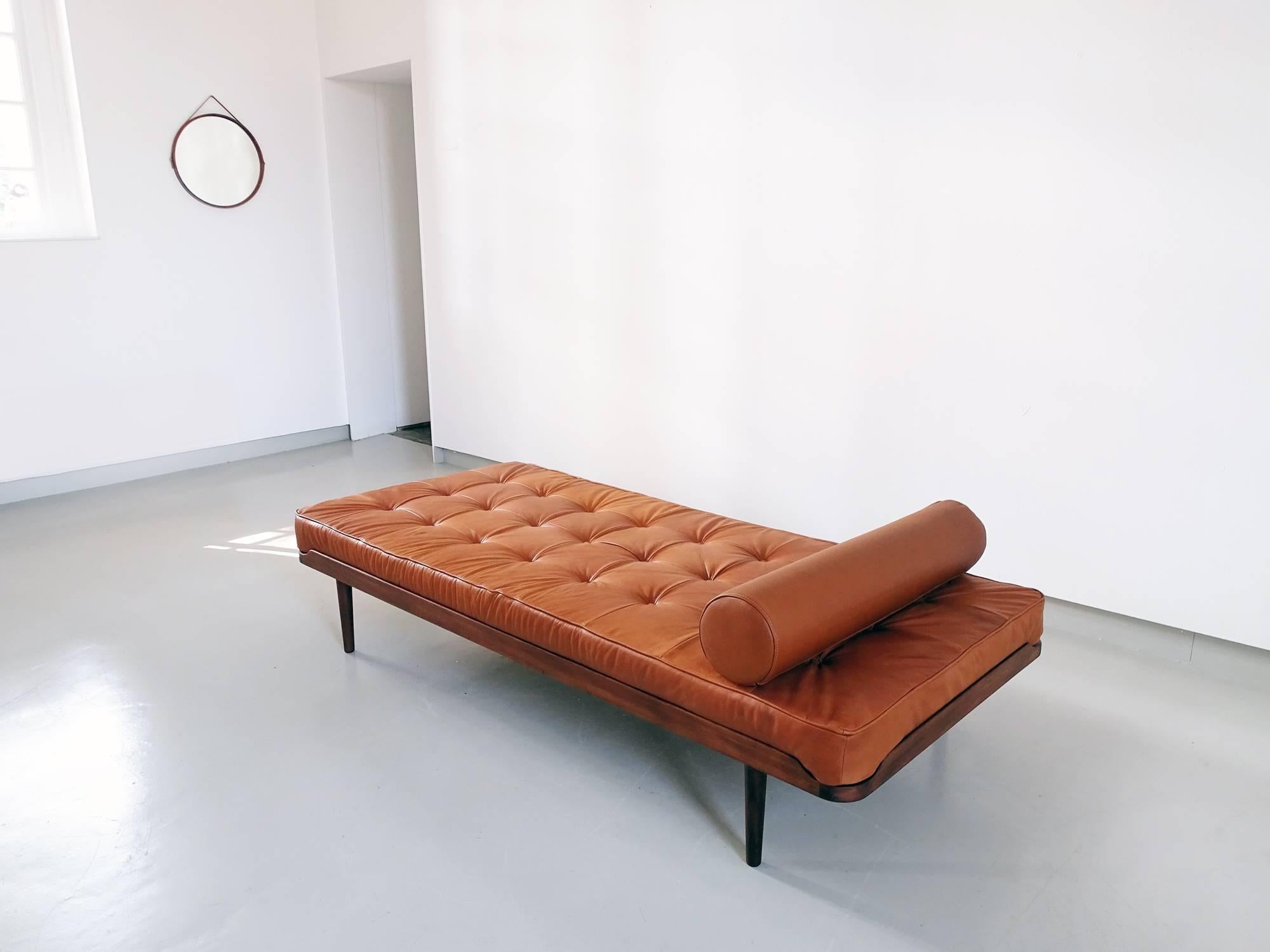 Daybed designed by Grete Jalk manufactured by Danish cabinetmaker P. Jeppesen, Denmark, circa 1950. The daybed is executed in solid teak wood and a slatted oak wood frame. Beautiful rounded edges en curved corner details give this classic Danish
