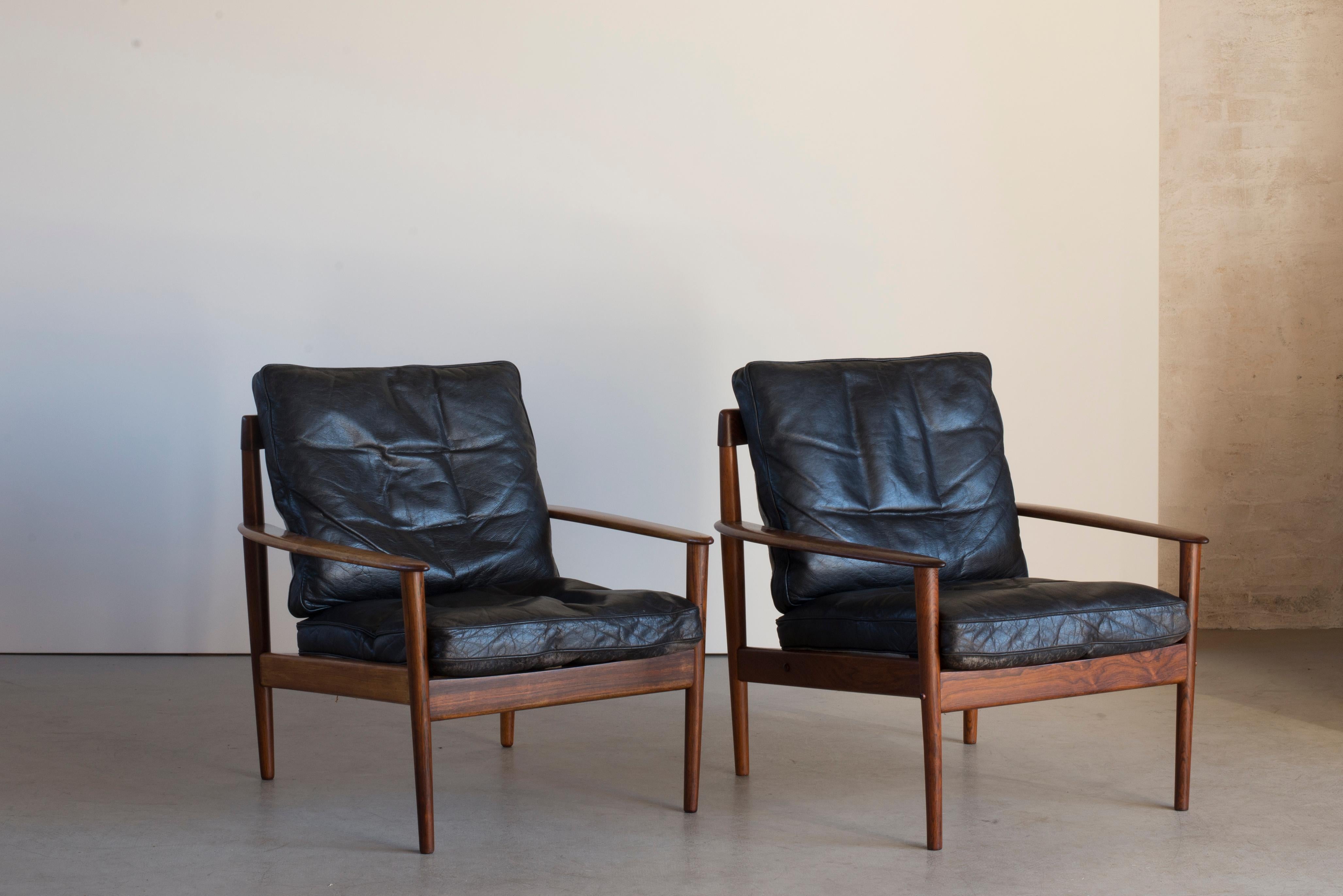 Grete Jalk easy chairs of rosewood and leather. Executed by France & Son, Denmark.
