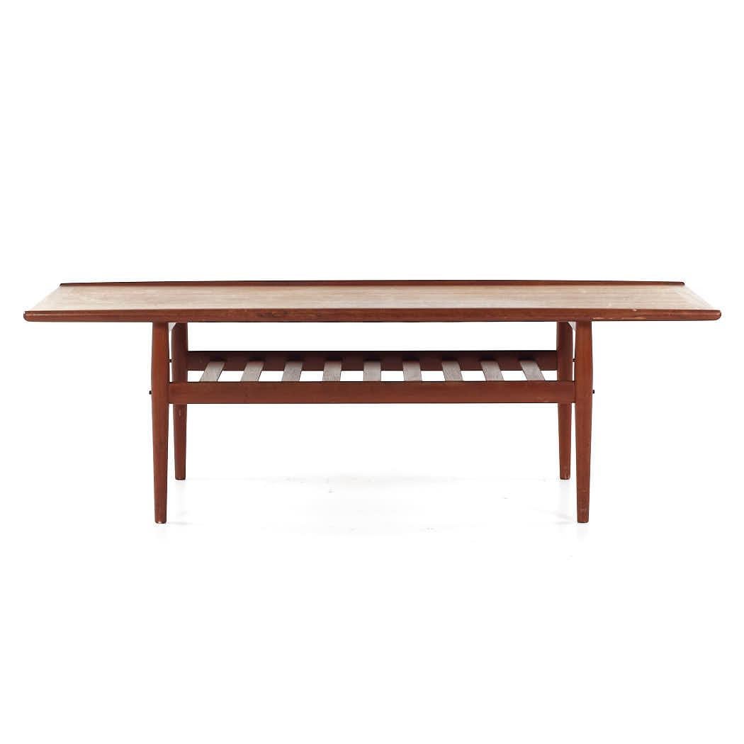 Grete Jalk for Glostrup Mid Century Danish Teak Coffee Table

This coffee table measures: 63.25 wide x 23.25 deep x 20.25 inches high

All pieces of furniture can be had in what we call restored vintage condition. That means the piece is restored