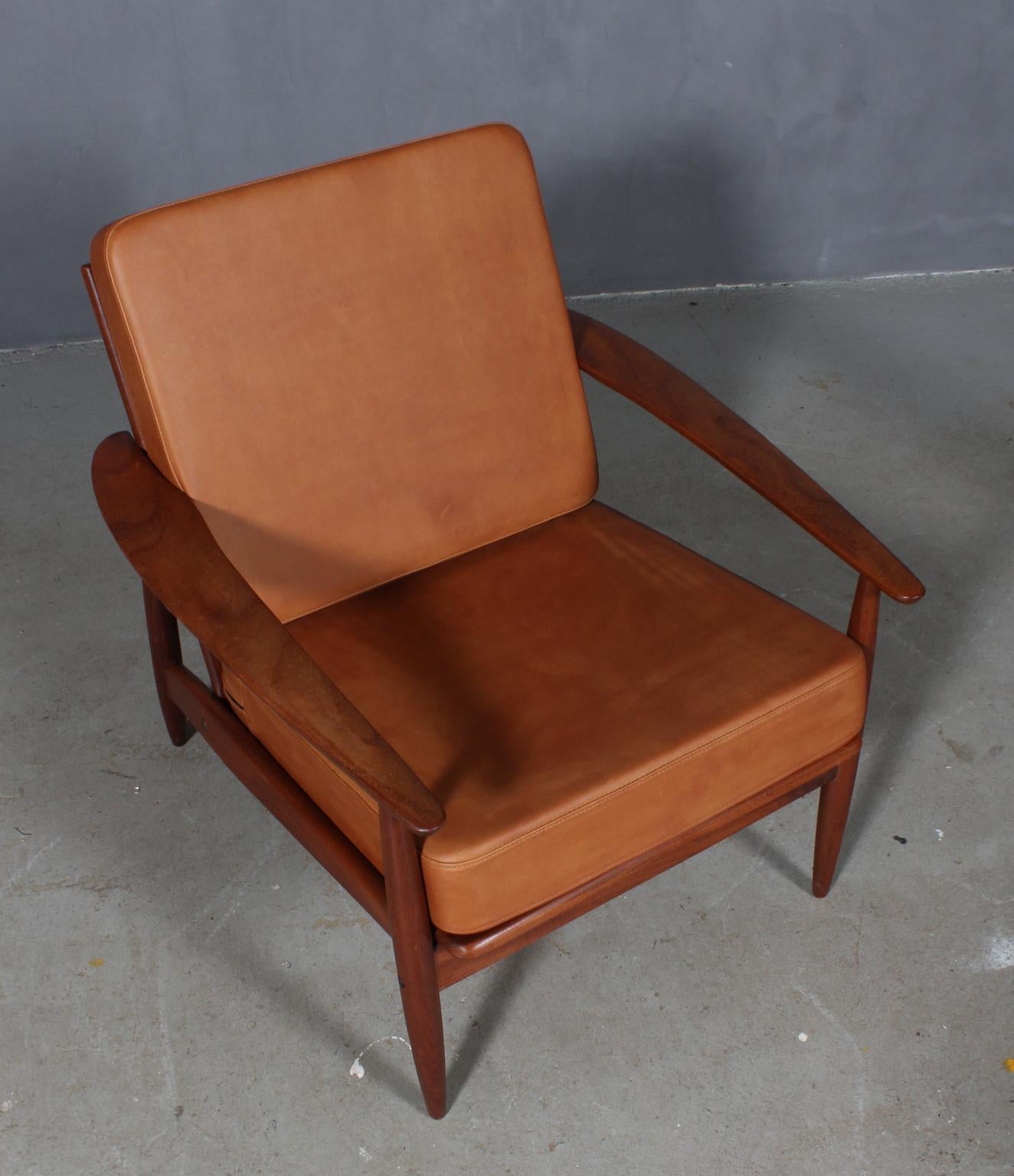 Grete Jalk lounge chair with teak frame.

New upholstered cushions with vintage tan aniline leather.
