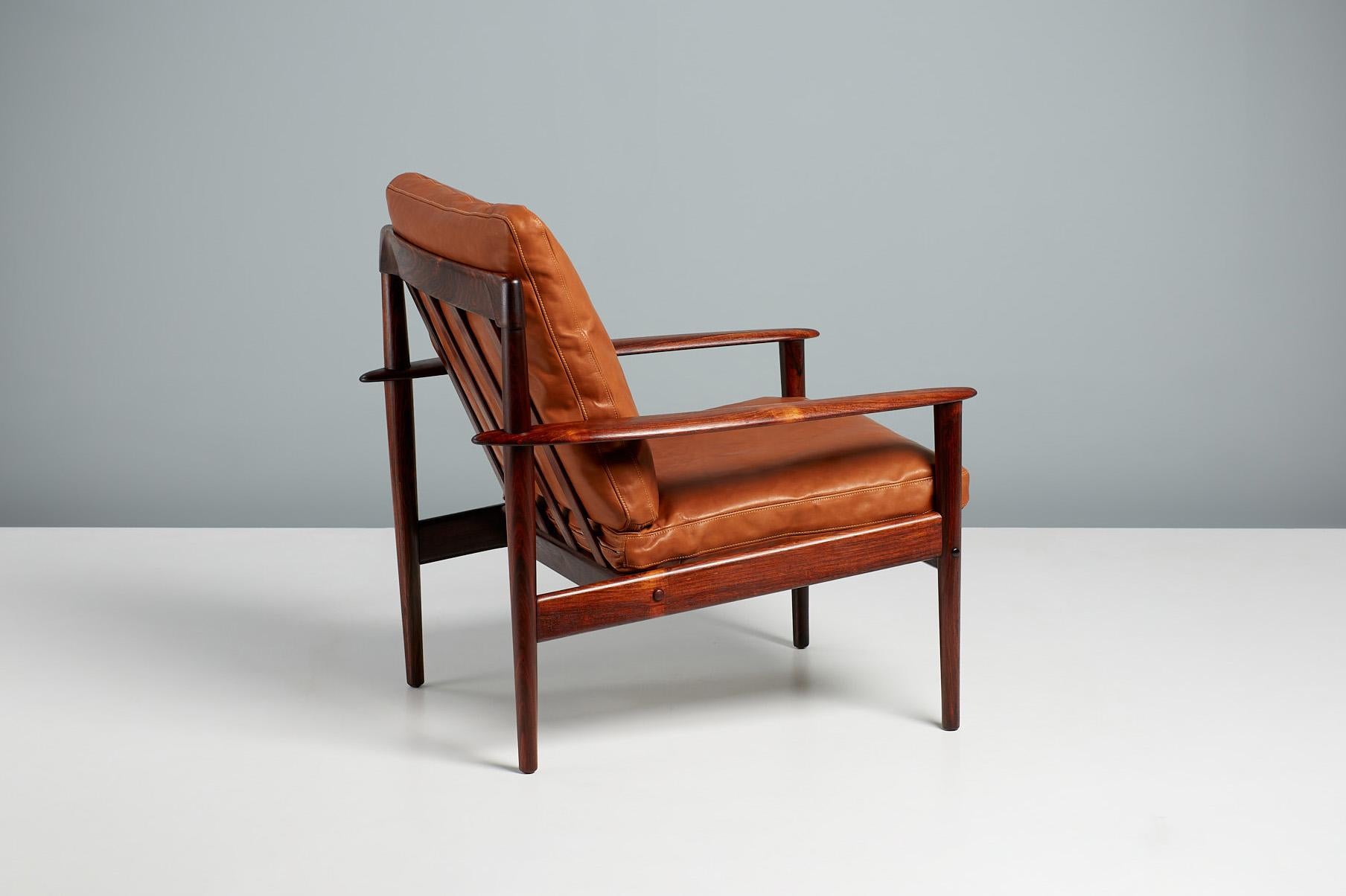 Grete Jalk Model PJ-56 lounge chair

A beautiful lounge chair designed by Grete Jalk for cabinetmaker Poul Jeppesen in Denmark, circa 1956. This examples come in stunning rosewood with a particularly unusual, exotic grain. The chair comes with