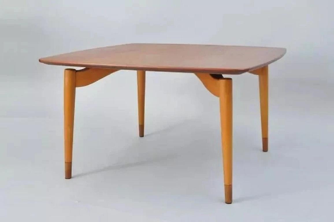 Vintage Grete Jalk Poul Jeppesen Mid Century Danish Modern Teak Floating Coffee Table. Item features a square teak wood top with rounded corners and four floating form sculptural tapered legs. Very clean modernist design. Branded on the underside of