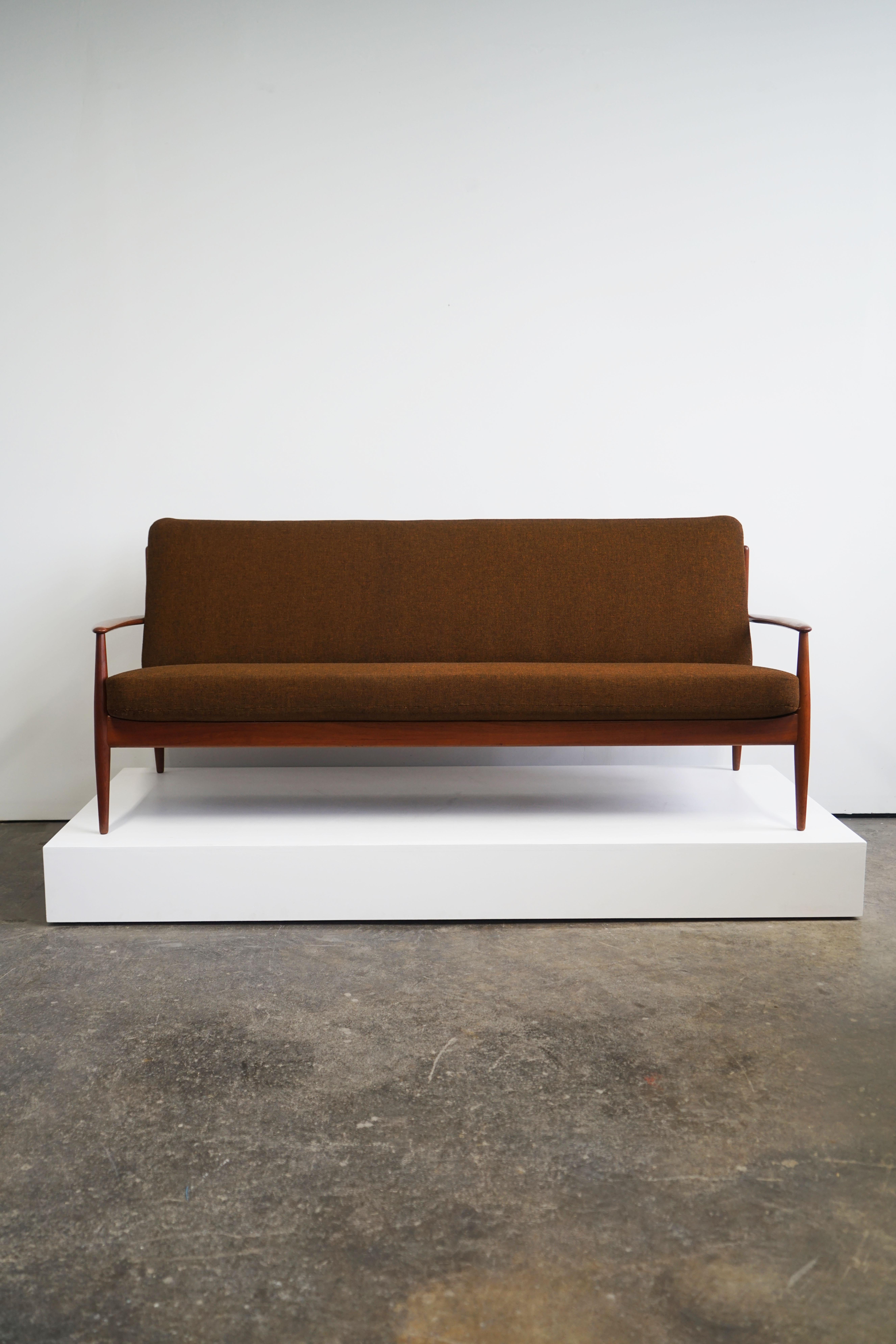 Grete Jalk sofa for France & Daverkosen
Denmark, circa 1955
Teak frame, upholstery. 

Measures: 80.5