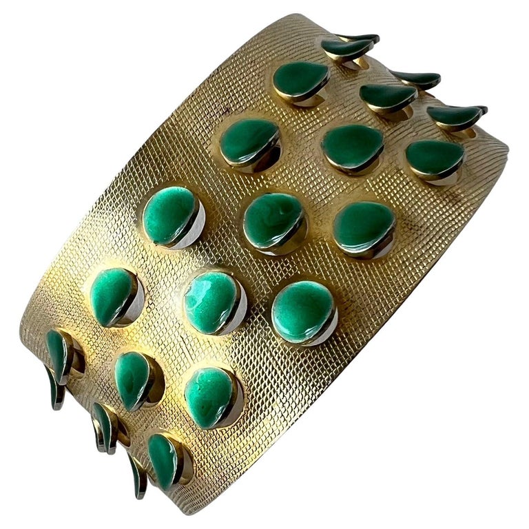 Iconic 1950s gold plated sterling silver bracelet with emerald green enameled scales or tabs created by Grete Prytz Kittelsen of Oslo, Norway.  Bracelet measures 1 3/8