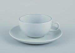 Grethe Meyer for Aluminia. Set of four Blue line coffee cups with saucers.