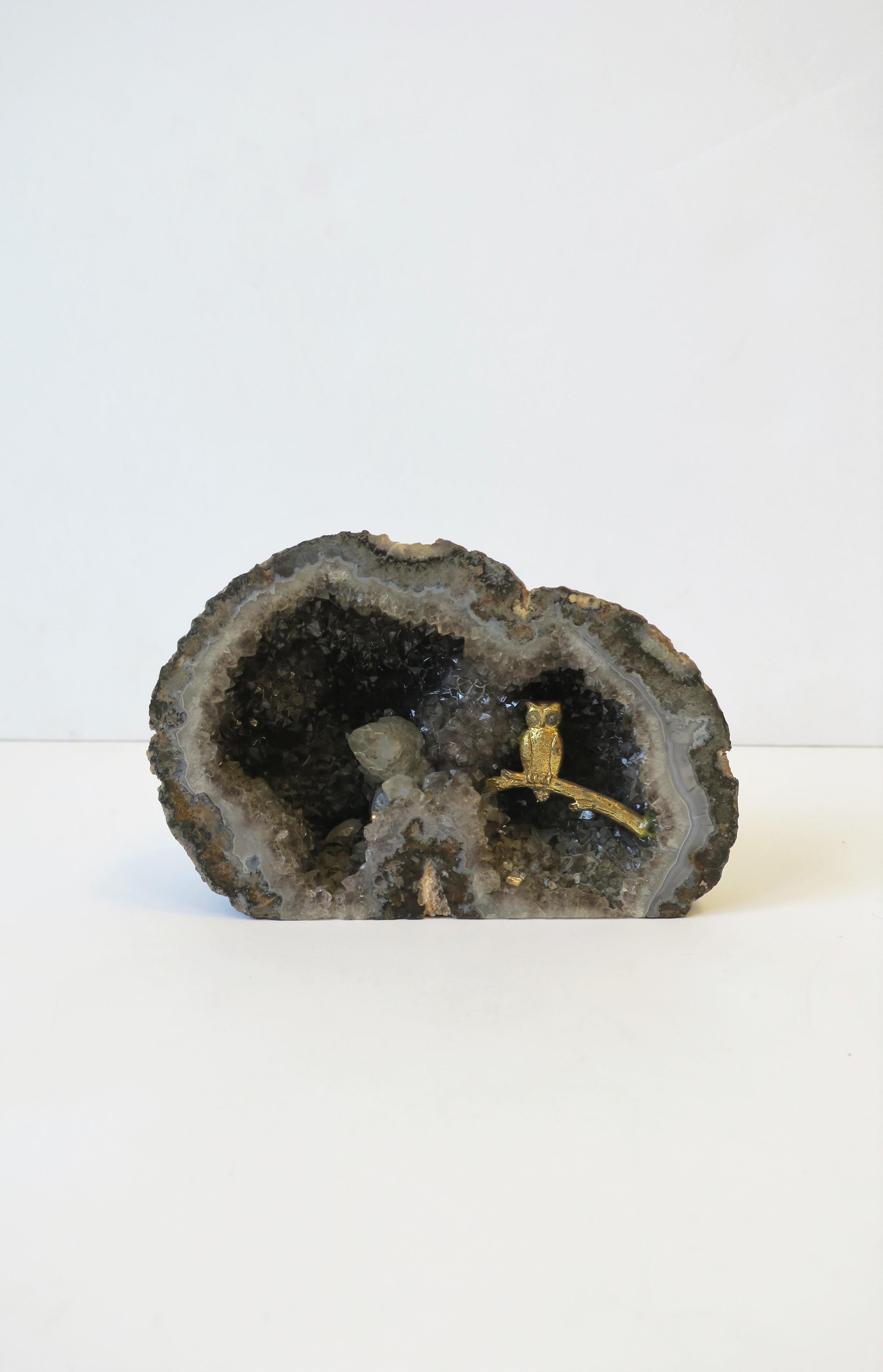 A beautiful and substantial grey/gray agate crystal geode with perched brass owl bird on branch. Natural beautiful shades of grey make up this decorative object. Piece can work well on/in a shelf, credenza, office, library, etc. Dimensions: 3.63