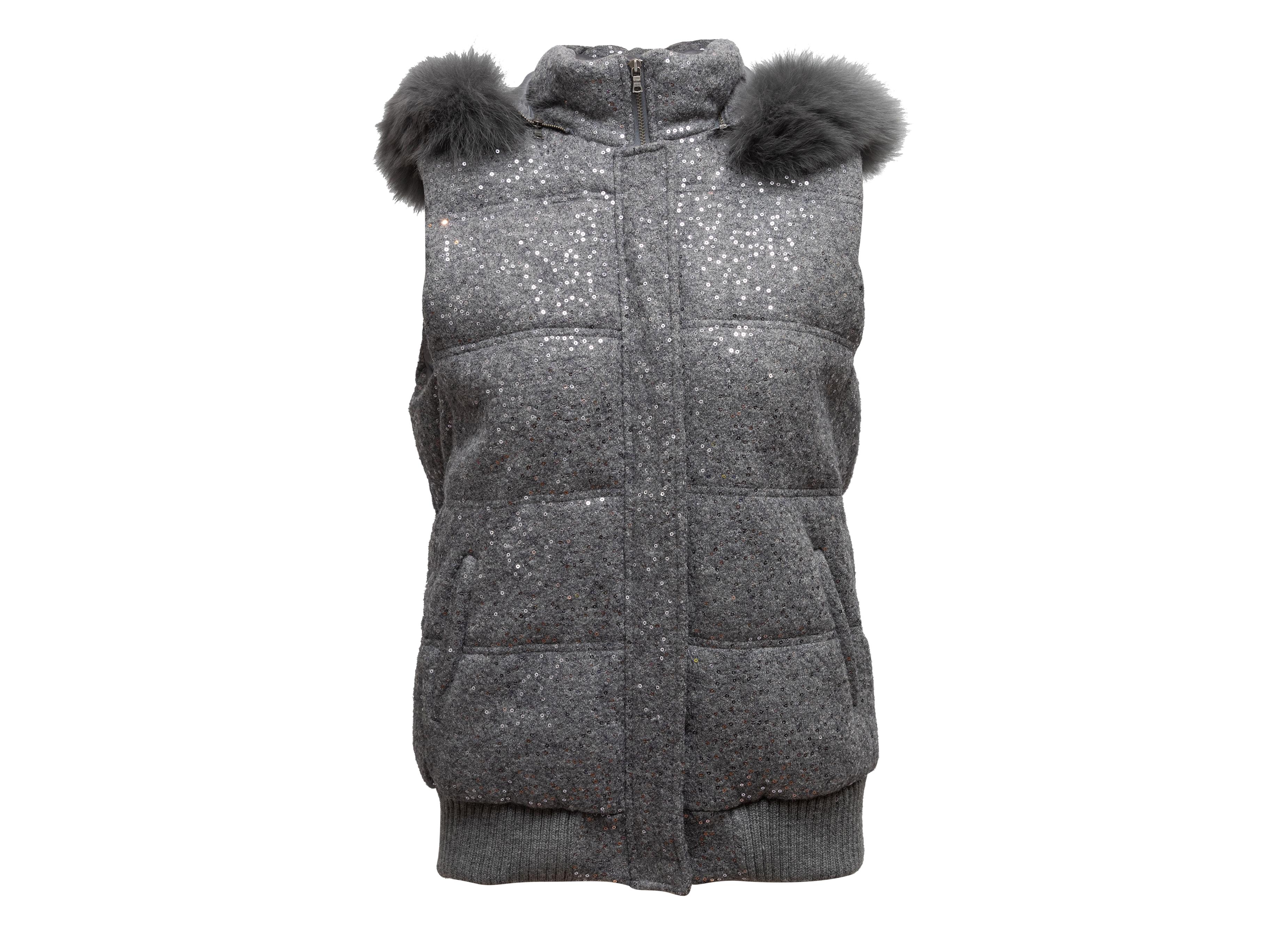 Grey sequined puffer vest by Alice + Olivia. Fox fur-trimmed hood. Dual hip pockets. Zip closure at center front. 42