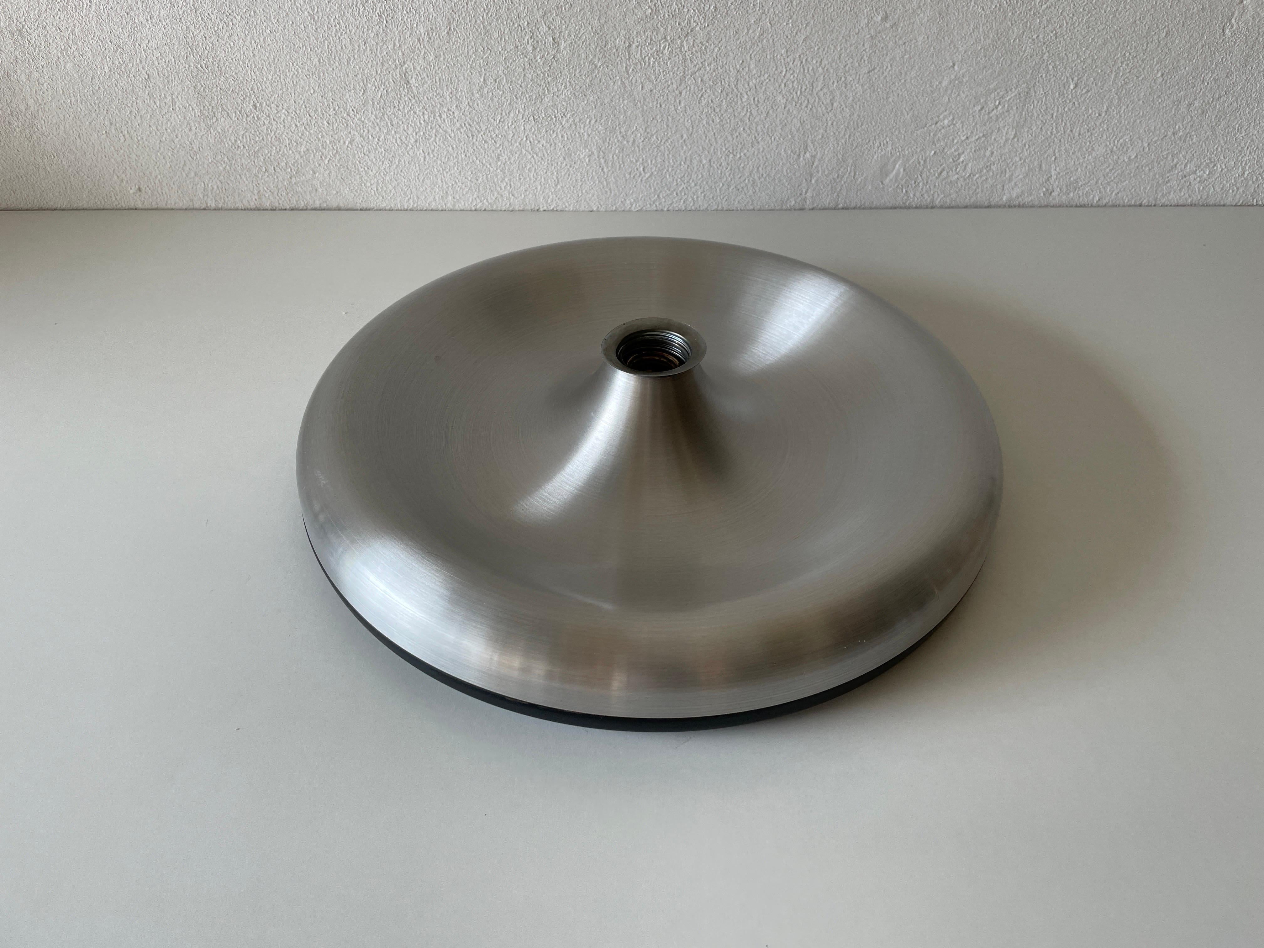 Grey Aluminum and Black Metal Space Age Disc Design Flush Mount, 1970s, Germany

Manufactured in Germany
Lamps are in perfect condition.
This lamp works with E27standard light bulbs.
Wired and suitable to use in all countries.


Measurements: