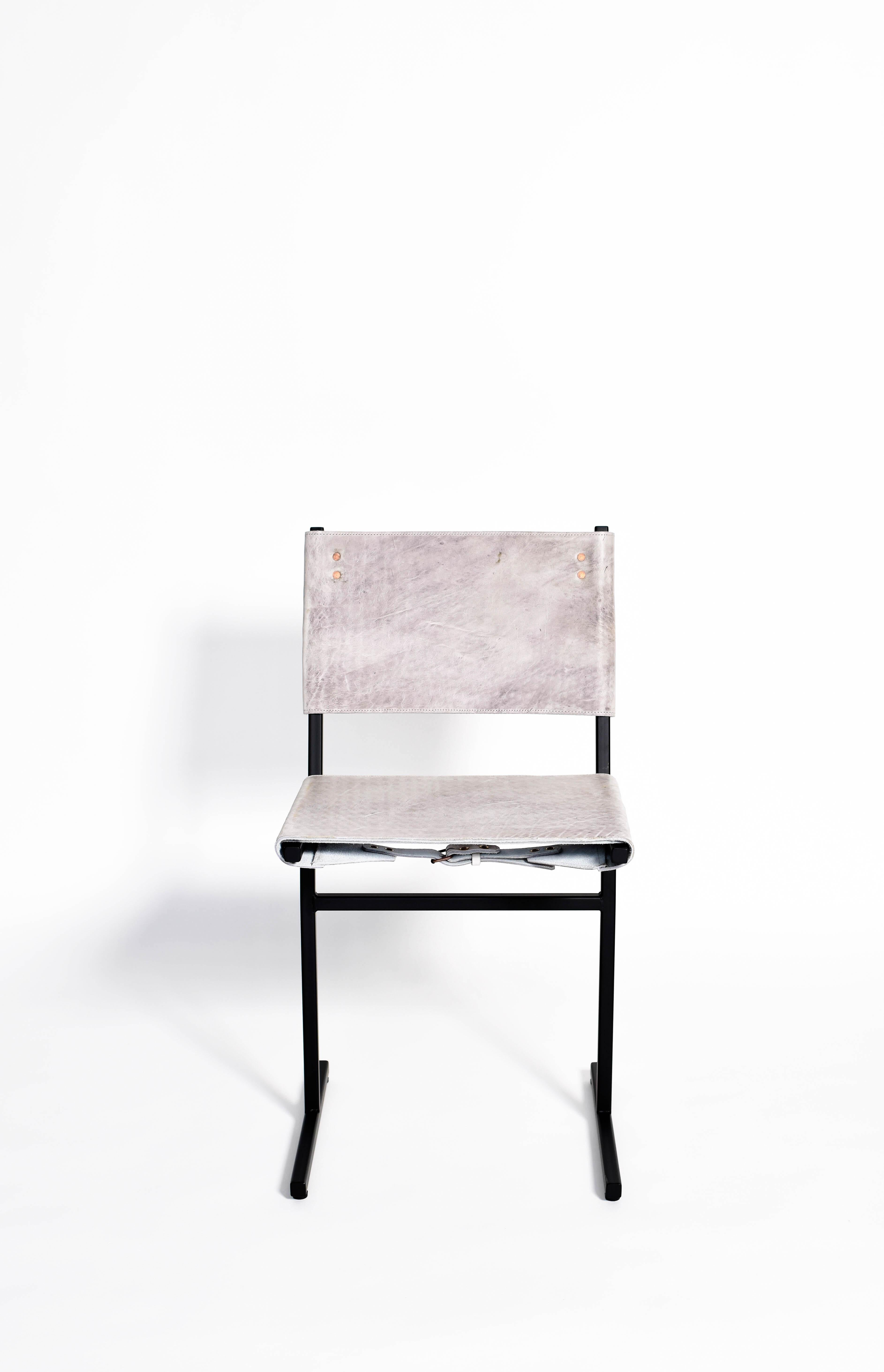 Grey and black Memento chair, Jesse Sanderson
Original signed chair by Jesse Sanderson
Materials: Leather, steel
Dimensions: W 43 x D 50 x H 80 cm 
 Seating height: 47 cm

Frame finishes available in brass, bare steel, matt black.

Five