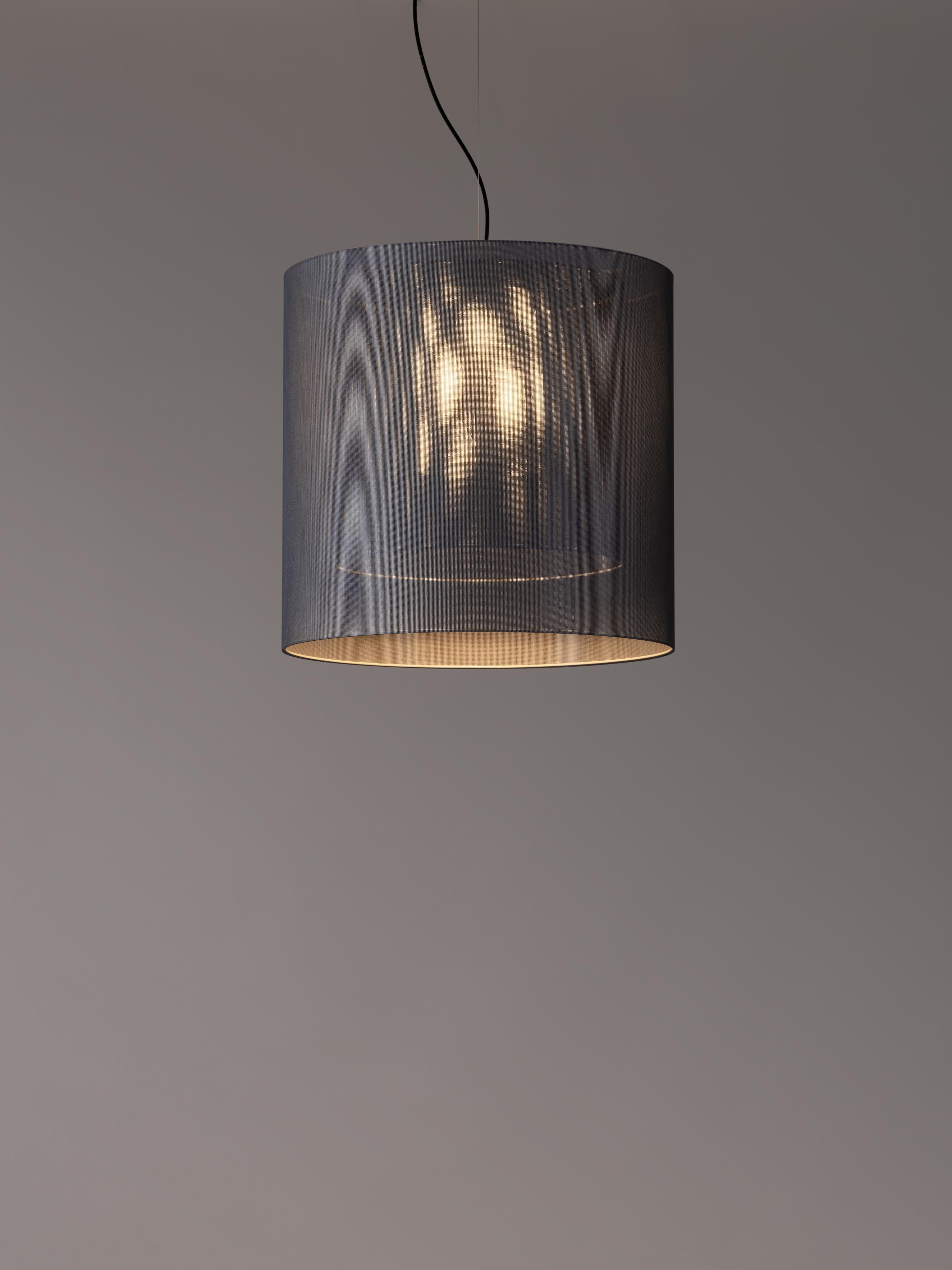 Grey and Black Moaré LM pendant lamp by Antoni Arola
Dimensions: D 62 x H 60 cm
Materials: Metal, polyester.
Available in other colors and sizes.

Moaré’s multiple combinations of formats and colours make it highly versatile. The series takes