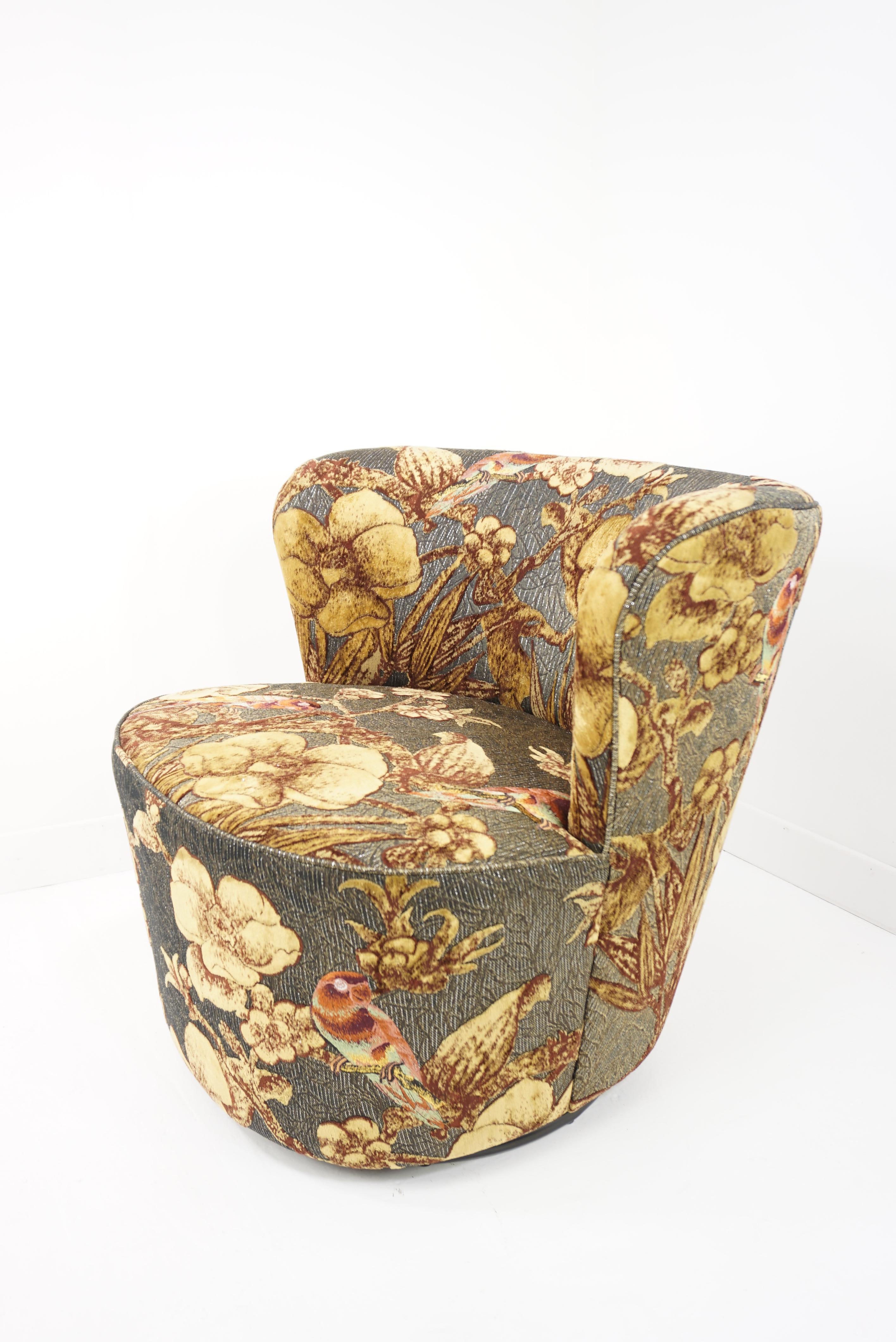 Egg shaped grey velvet and fabric with parrots and gold touch swivel and lounge comfy armchair in Art Deco style.