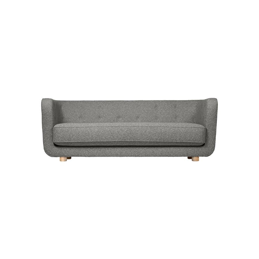Grey and natural oak Hallingdal Vilhelm sofa by Lassen
Dimensions: W 217 x D 88 x H 80 cm 
Materials: Textile, oak.

Vilhelm is a beautiful padded three-seater sofa designed by Flemming Lassen in 1935. A sofa must be able to function in several