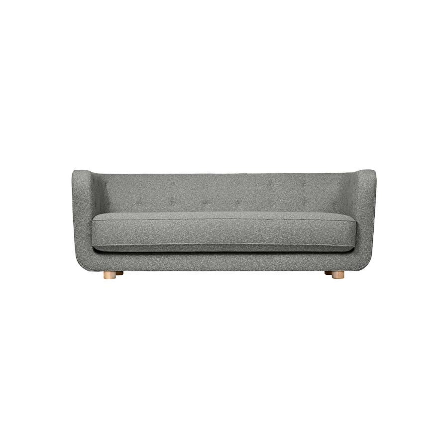 Grey and natural oak sahco nara vilhelm sofa by Lassen
Dimensions: W 217 x D 88 x H 80 cm 
Materials: Textile, oak.

Vilhelm is a beautiful padded three-seater sofa designed by Flemming Lassen in 1935. A sofa must be able to function in several