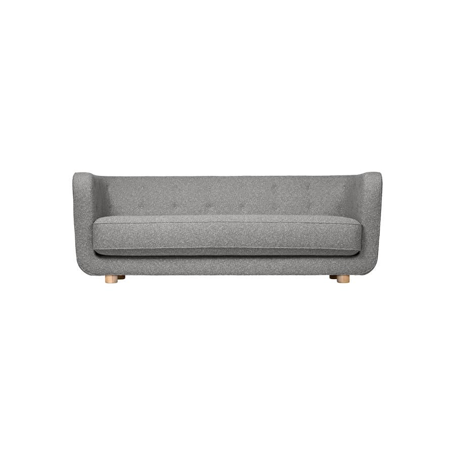 Grey and natural Oak Sahco Zero Vilhelm sofa by Lassen
Dimensions: W 217 x D 88 x H 80 cm 
Materials: Textile, Oak.

Vilhelm is a beautiful padded three-seater sofa designed by Flemming Lassen in 1935. A sofa must be able to function in several