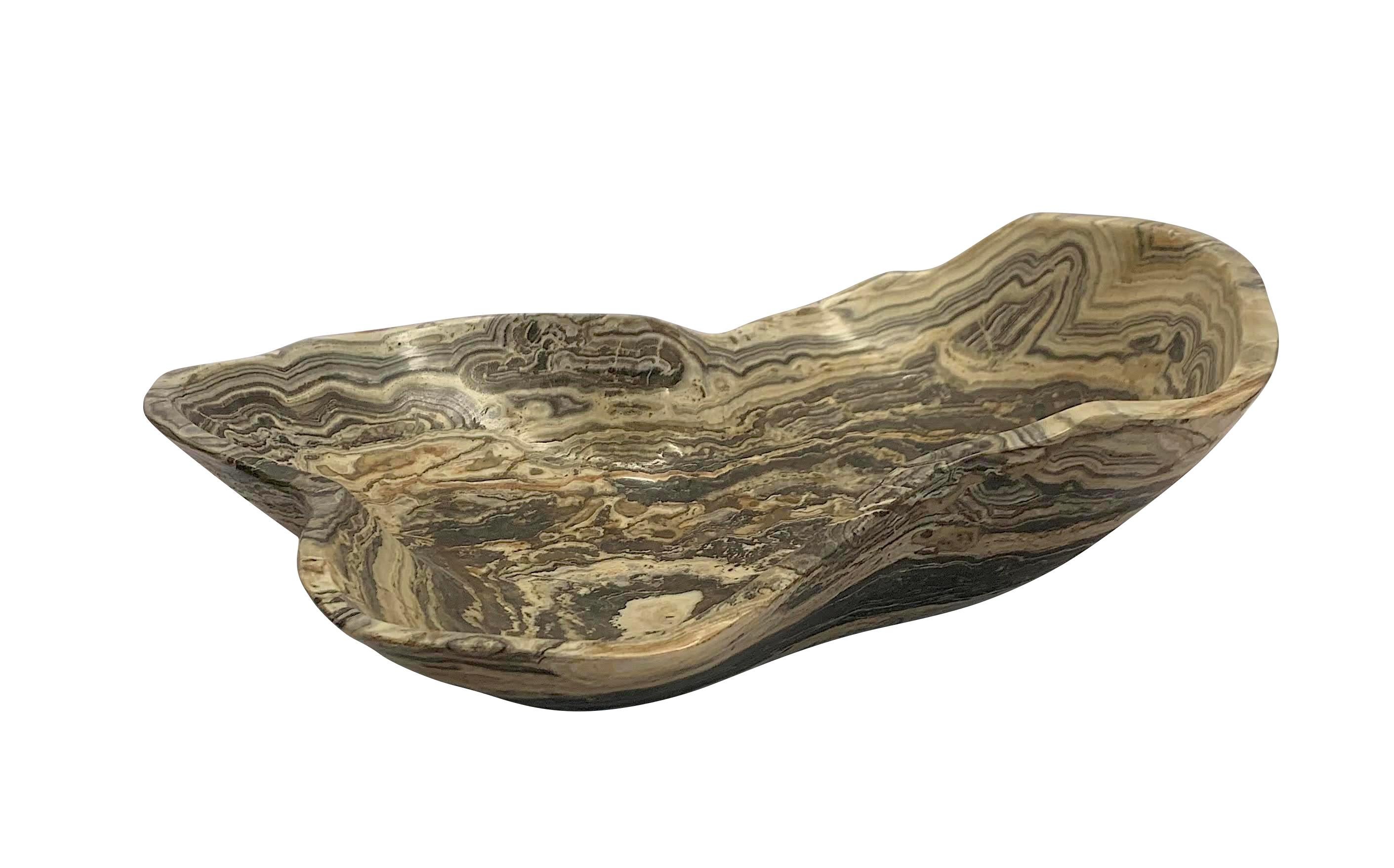 Contemporary Moroccan free form shaped onyx bowl.
Grey and off white in color.
From a large collection of different shapes, sizes and colors.