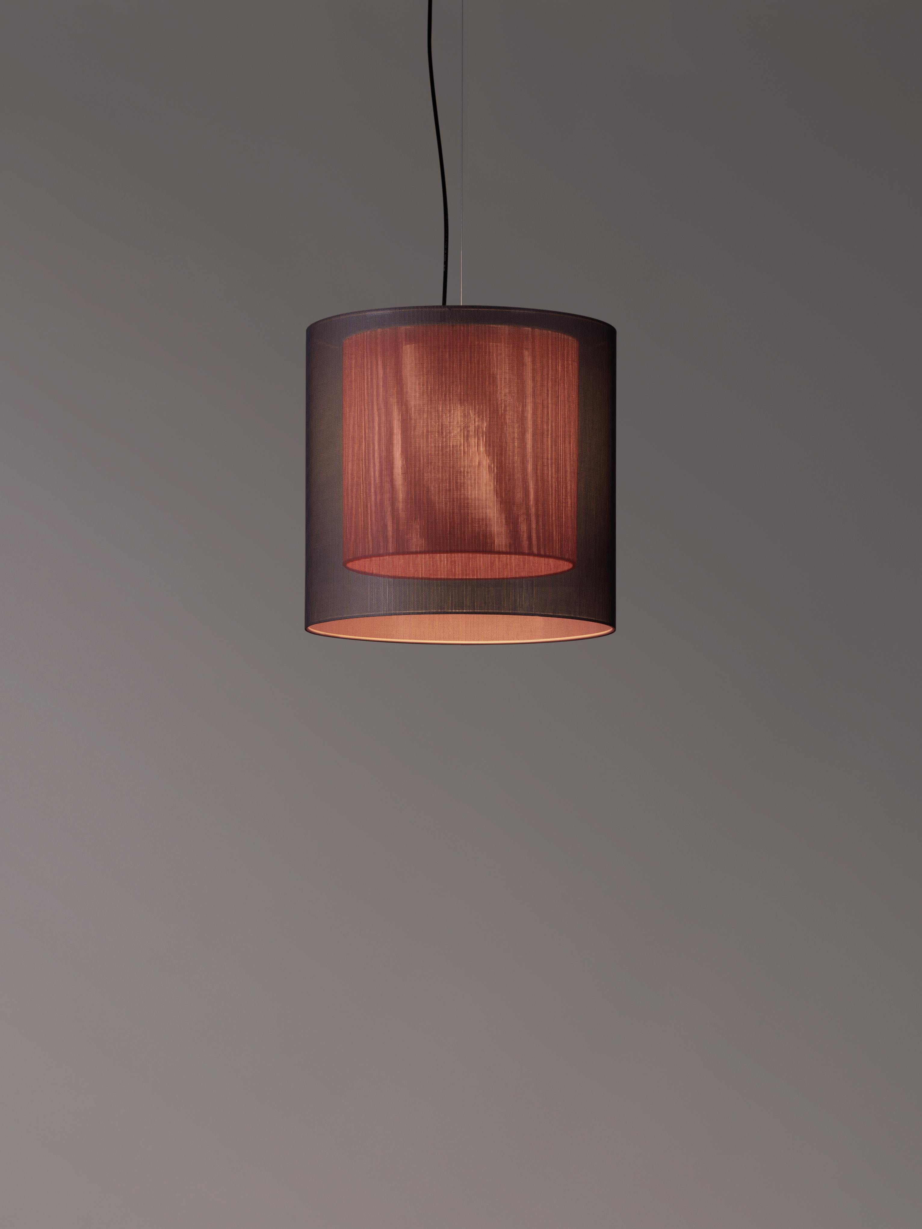 Grey and red Moaré MS pendant lamp by Antoni Arola
Dimensions: D 46 x H 45 cm
Materials: Metal, polyester.
Available in other colors and sizes.

Moaré’s multiple combinations of formats and colours make it highly versatile. The series takes its