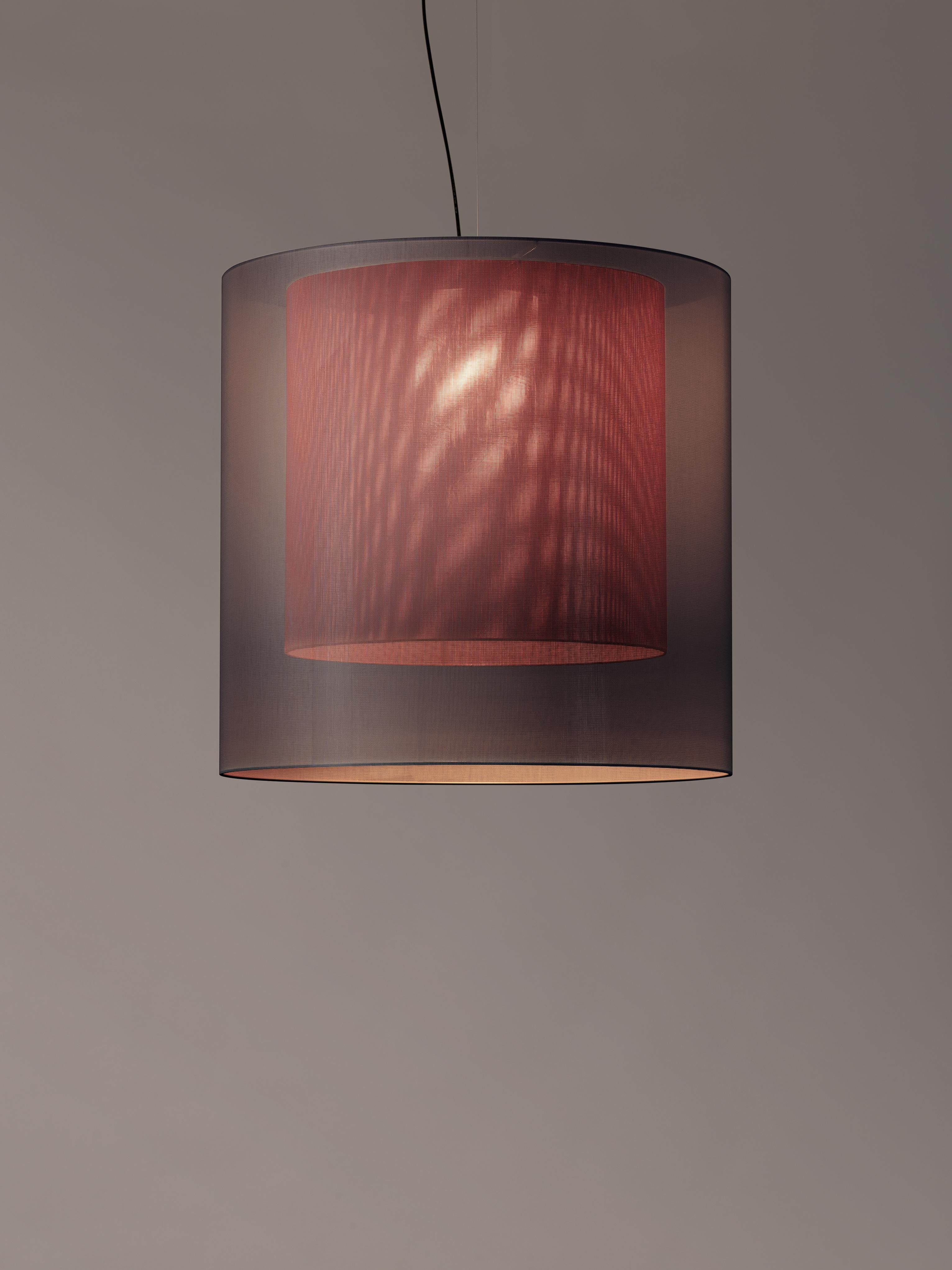 Grey and red moaré XL pendant lamp by Antoni Arola
Dimensions: D 83 x H 81 cm.
Materials: Metal, polyester.
Available in other colors and sizes.

Moaré’s multiple combinations of formats and colours make it highly versatile. The series takes