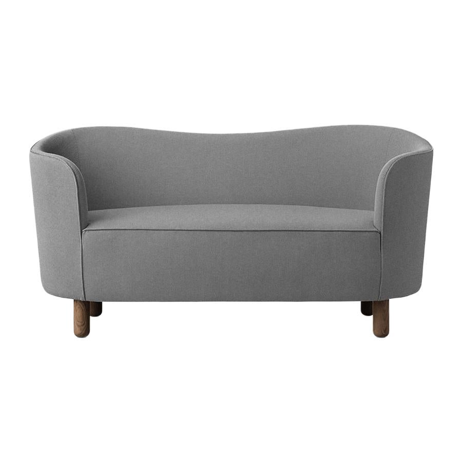 Grey and smoked oak Raf Simons Vidar 3 mingle sofa by Lassen.
Dimensions: W 154 x D 68 x H 74 cm. 
Materials: Textile, oak.

The Mingle sofa was designed in 1935 by architect Flemming Lassen (1902-1984) and was presented at The Copenhagen