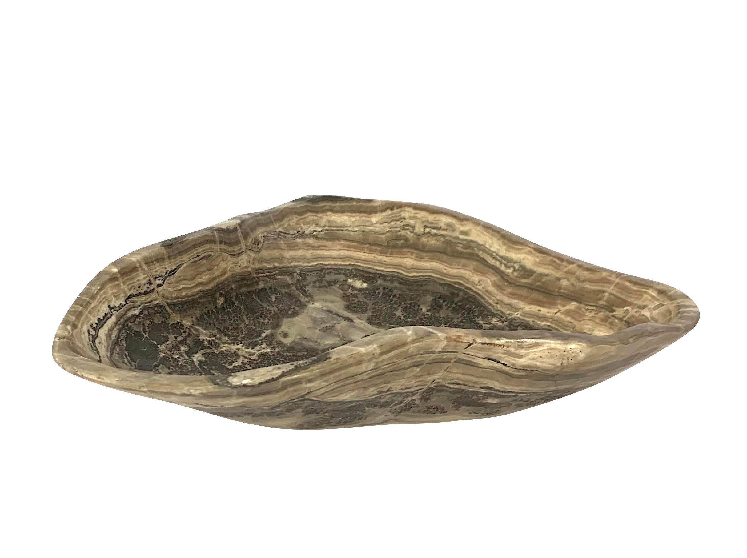 Contemporary Moroccan free form shaped onyx bowl.
Grey and taupe in color.
From a large collection of different shapes, sizes and colors.