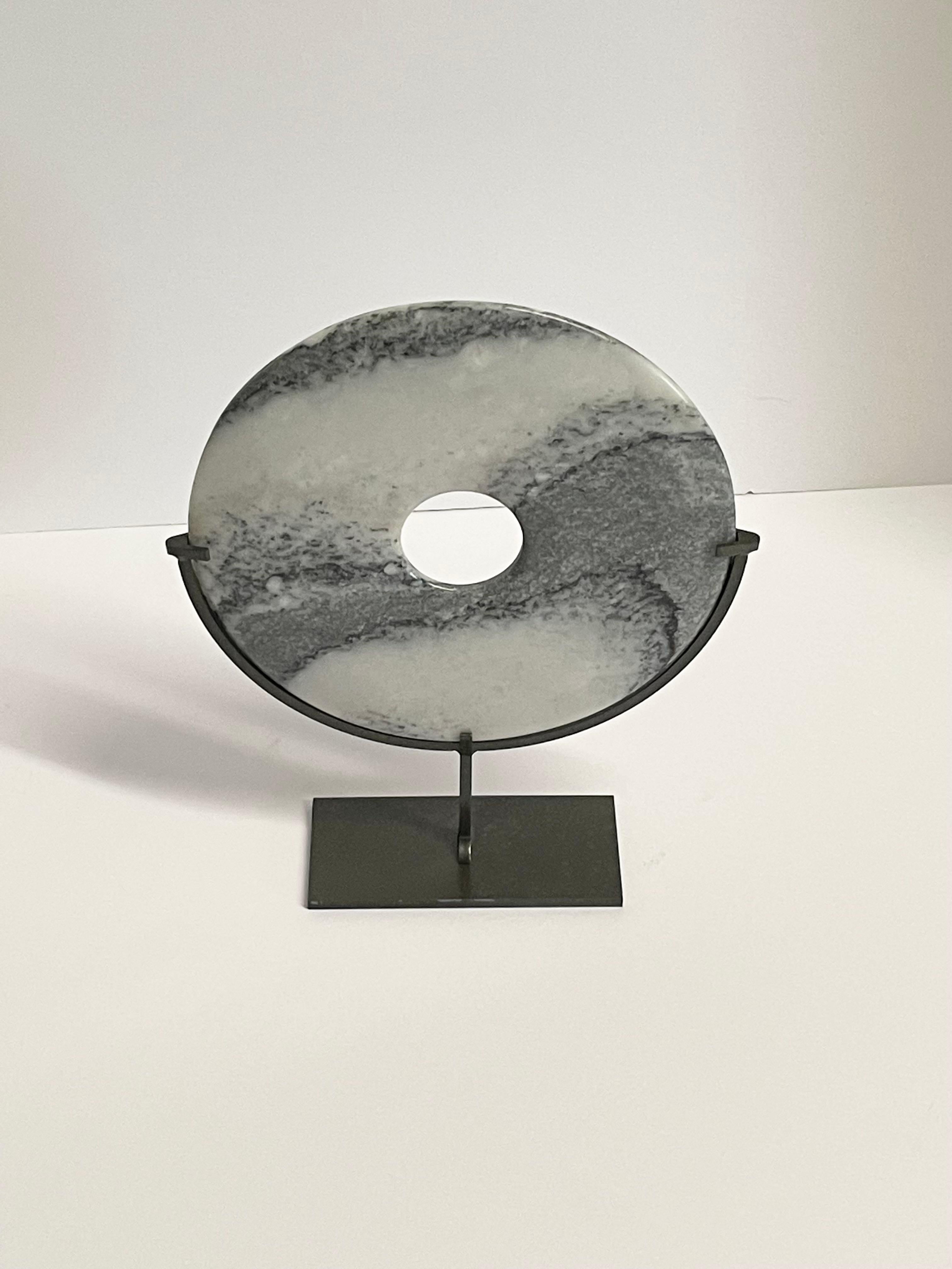 Contemporary Chinese shades of grey and white marble disc on steel stand.
Others available to make a larger grouping.