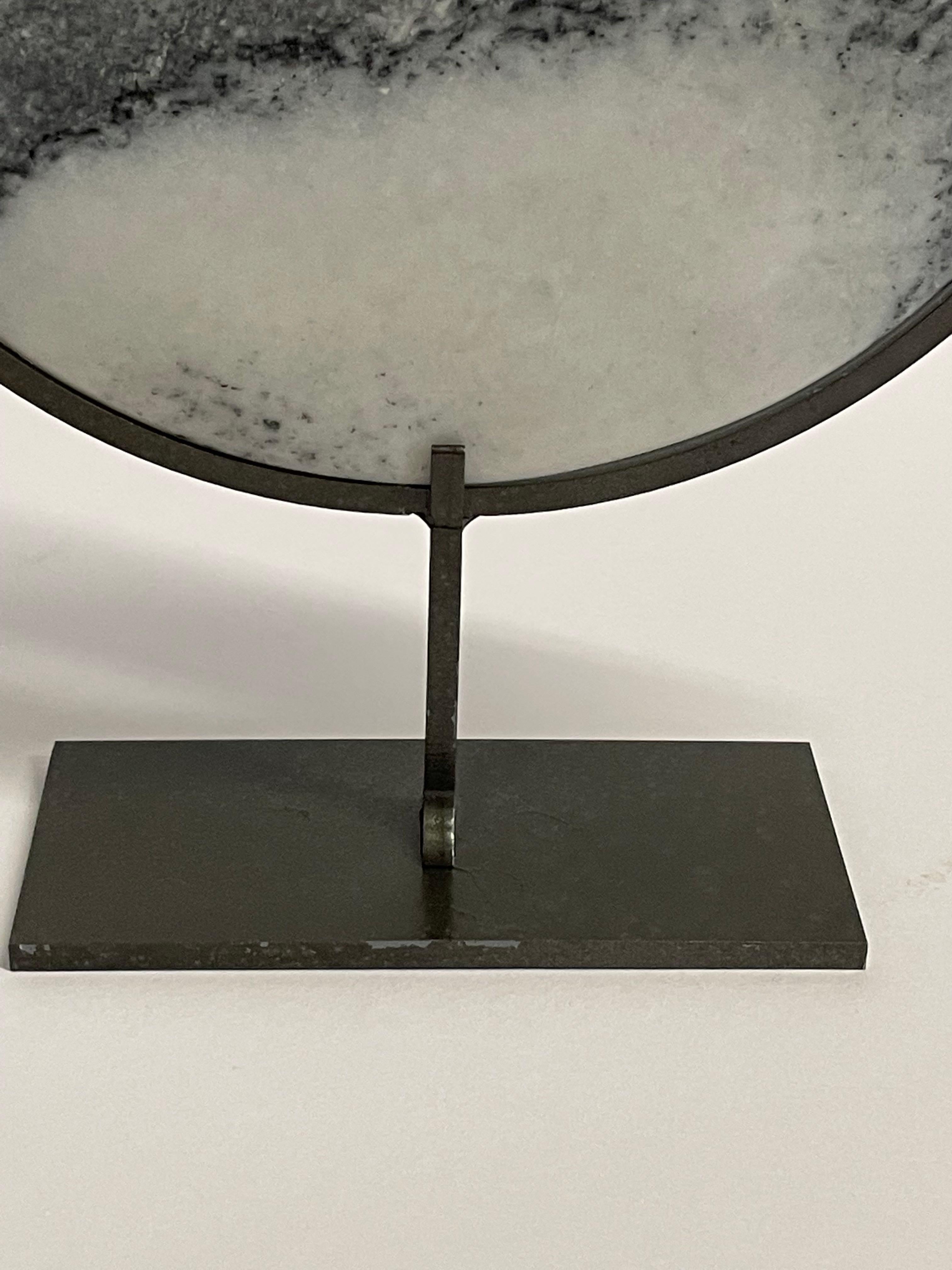 marble disc on stand