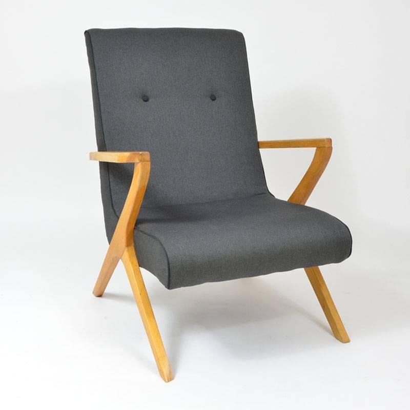 Matching armchairs with a dark grey cover and black selvage. Wooden frame of a non-traditional shape. Completely upholstered including the padding replacement. Partial renovation of the wooden frame. Czechoslovakia, 1970s.